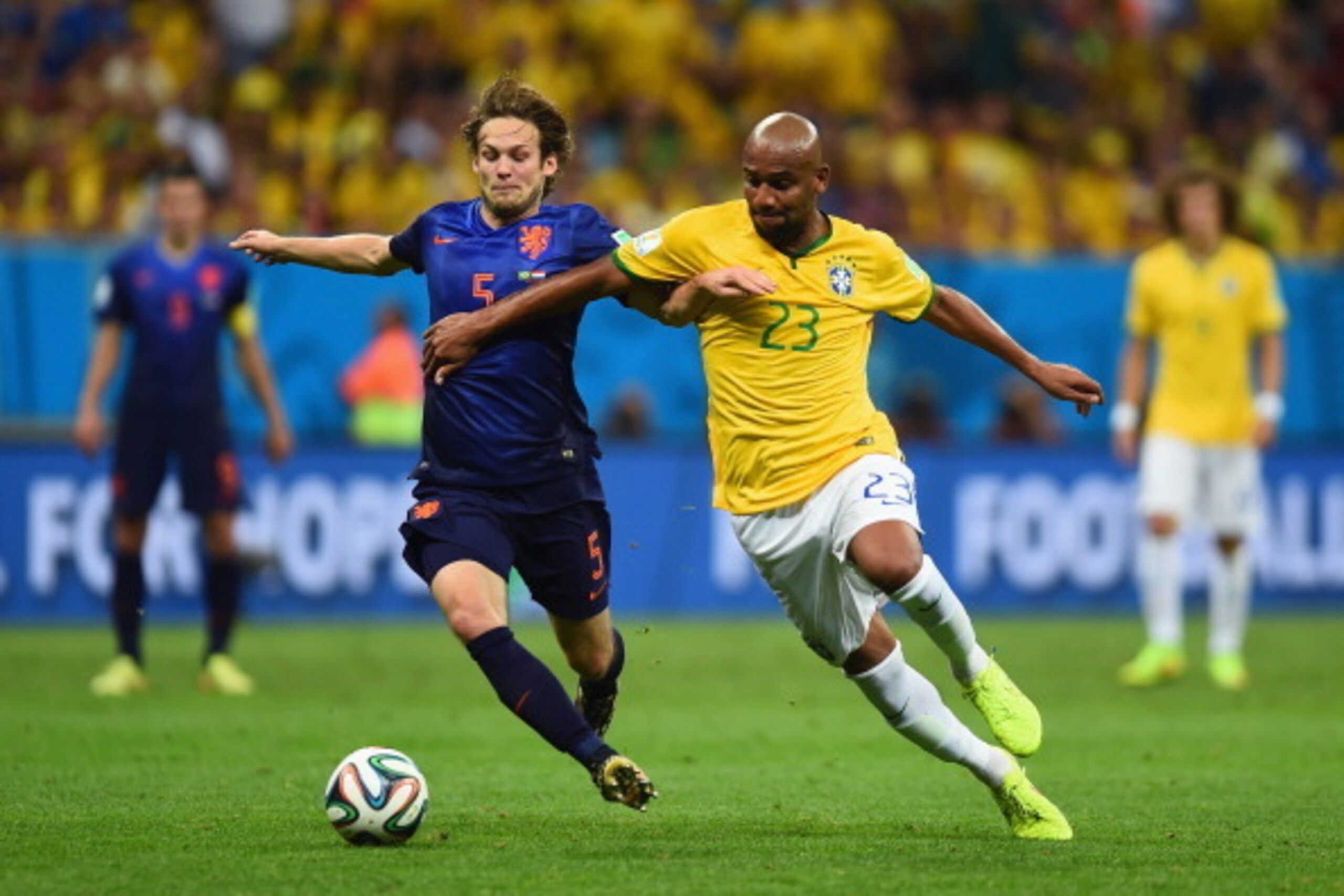 BRASILIA, BRAZIL - JULY 12: Daley Blind of the Netherlands challenges Maicon of Brazil during the 2014 FIFA World Cup Brazil Third Place Playoff match between Brazil and the Netherlands at Estadio Nacional on July 12, 2014 in Brasilia, Brazil.  (Photo by 
