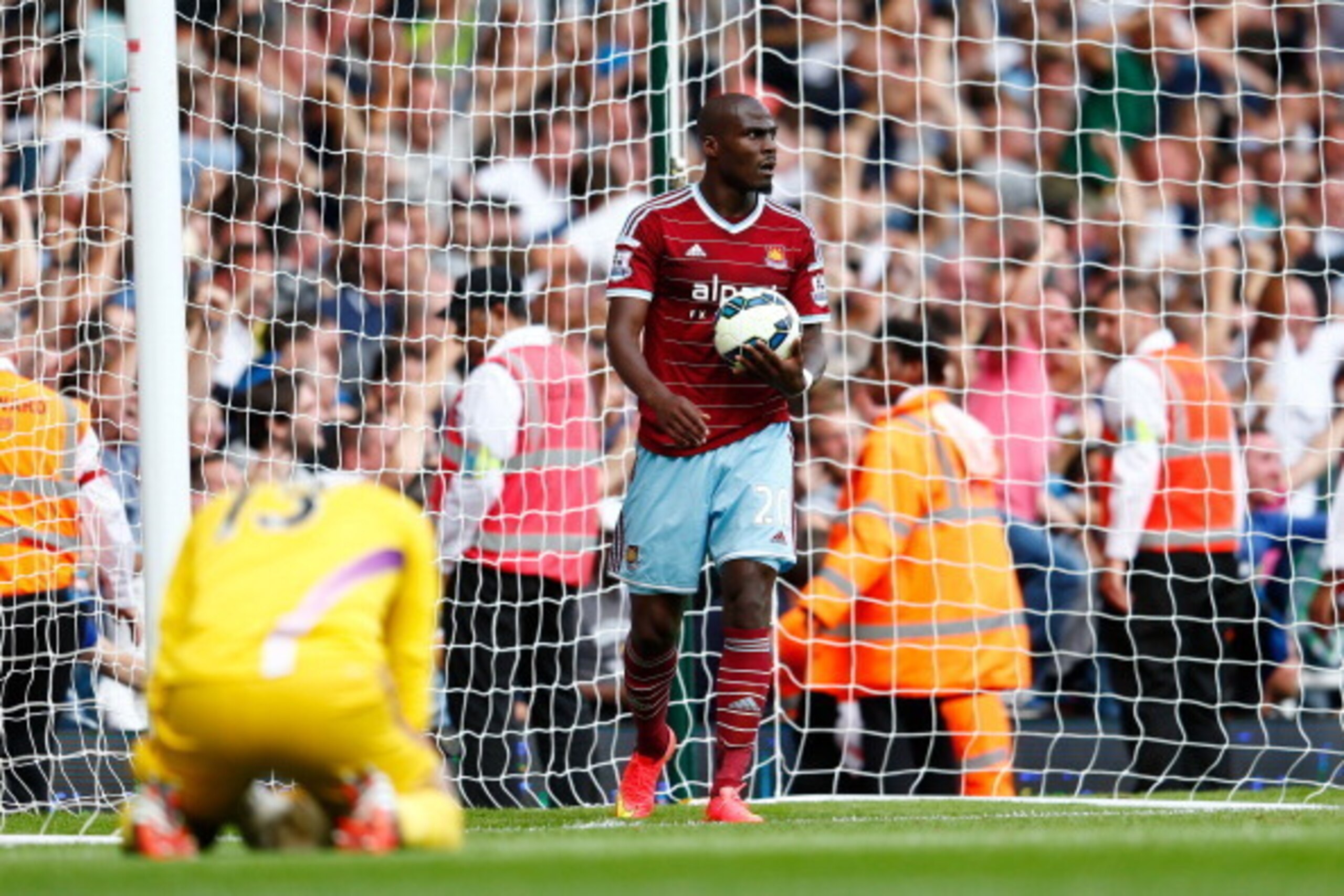 LONDON, ENGLAND - AUGUST 16: Dejected West Ham players Adrian #13 and Mohamed Diame look on after Eric Dier of Spurs scores the match winning goal during the Barclays Premier League match between West Ham United and Tottenham Hotspur at Boleyn Ground on LONDON, ENGLAND - AUGUST 16: Dejected West Ham players Adrian #13 and Mohamed Diame look on after Eric Dier of Spurs scores the match winning goal during the Barclays Premier League match between West Ham United and Tottenham Hotspur at Boleyn Ground on