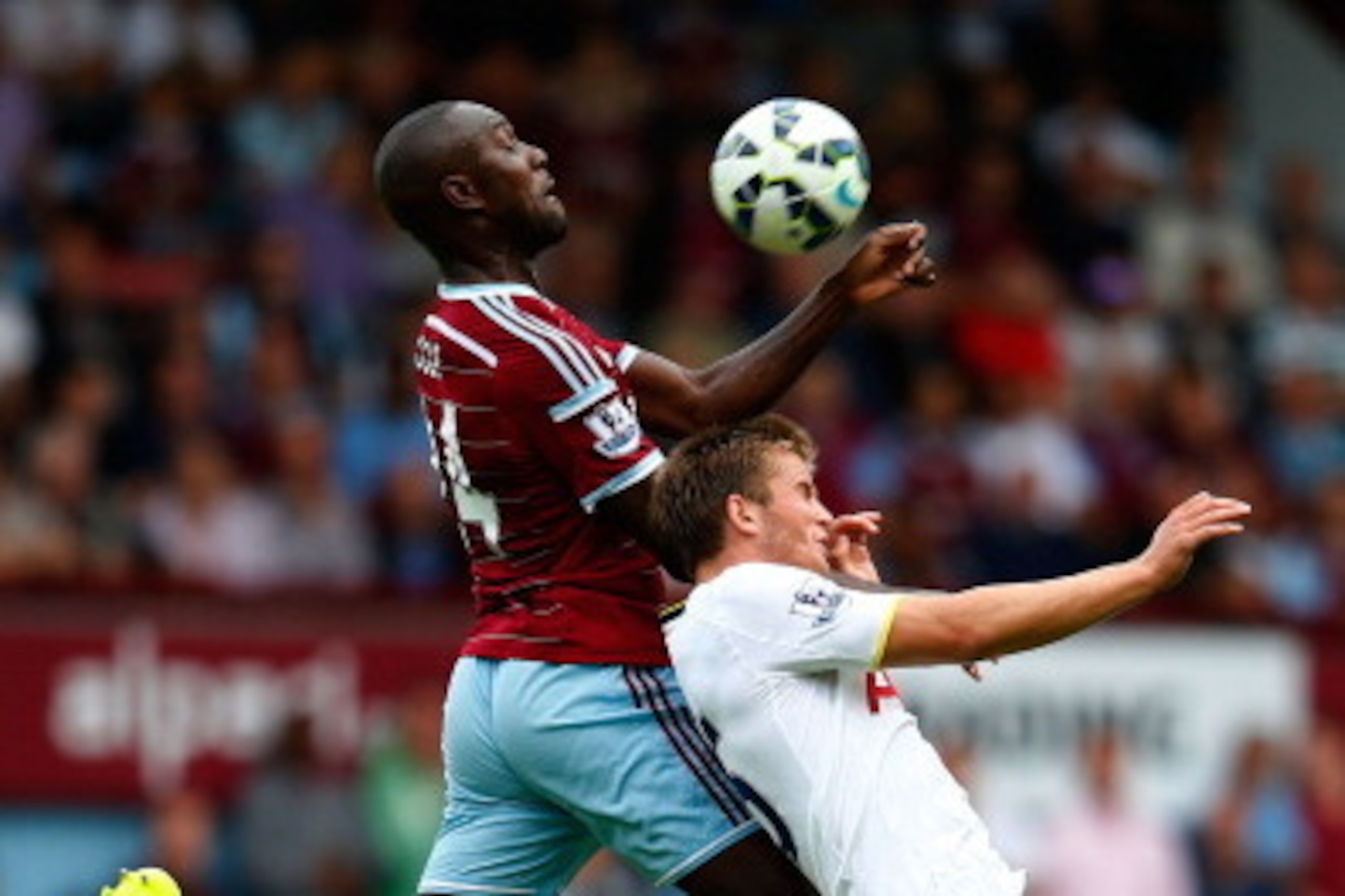 LONDON, ENGLAND - AUGUST 16:  Eric Dier of Tottenham Hotspur is beaten to the ball in the air by Carlton Cole of West Ham during the Barclays Premier League match between West Ham United and Tottenham Hotspur at Boleyn Ground on August 16, 2014 in London,