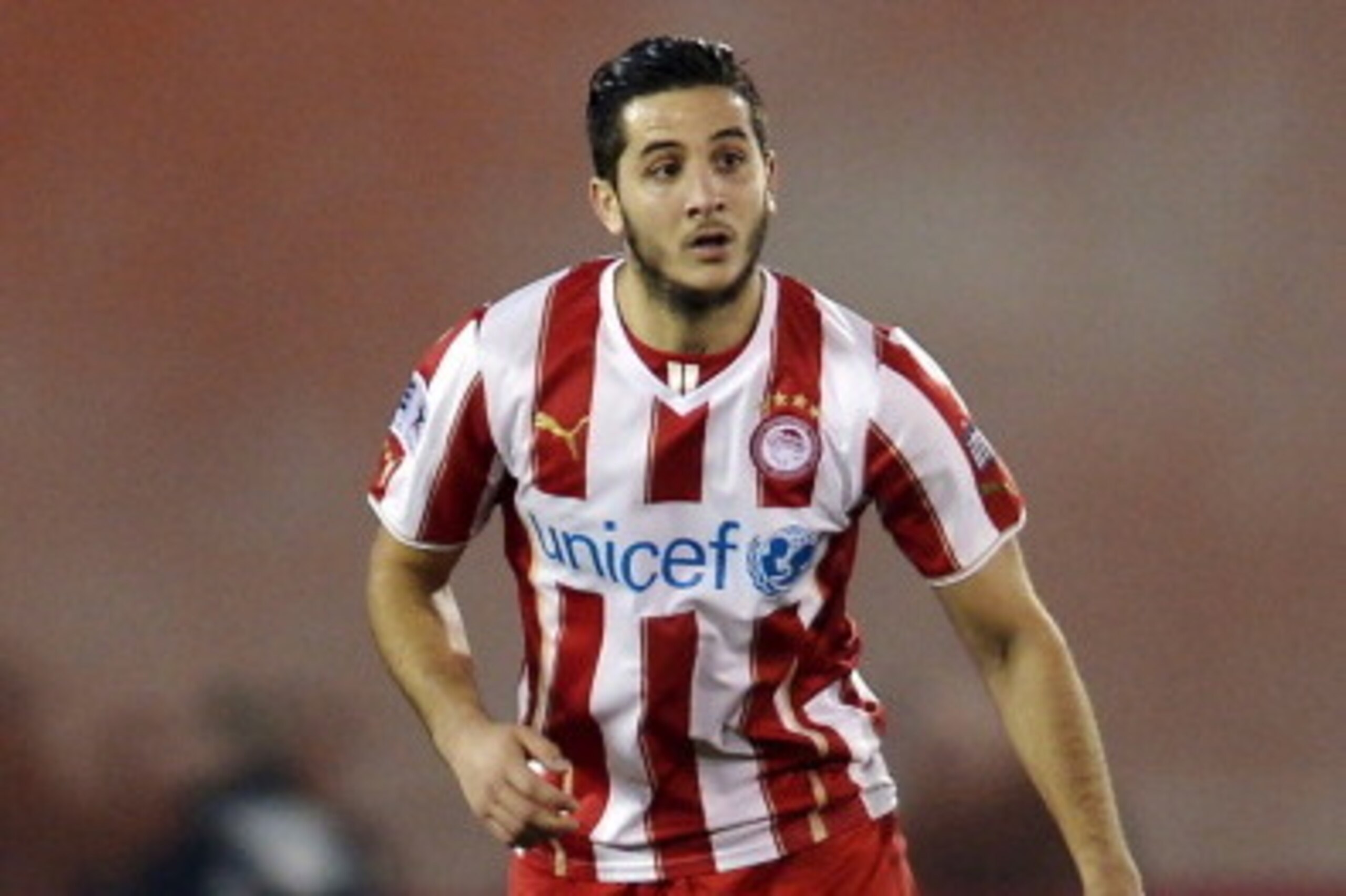 ATHENS,GREECE - JANUARY 12:  Kostas Manolas of Olympiacos during the Greek Superleague match between Atromitos Athinon and Olympiacos at the Peristeri Stadium on January 12, 2014 in Athens,Greece.  (Photo by Aris Messins/EuroFootball/Getty Images)