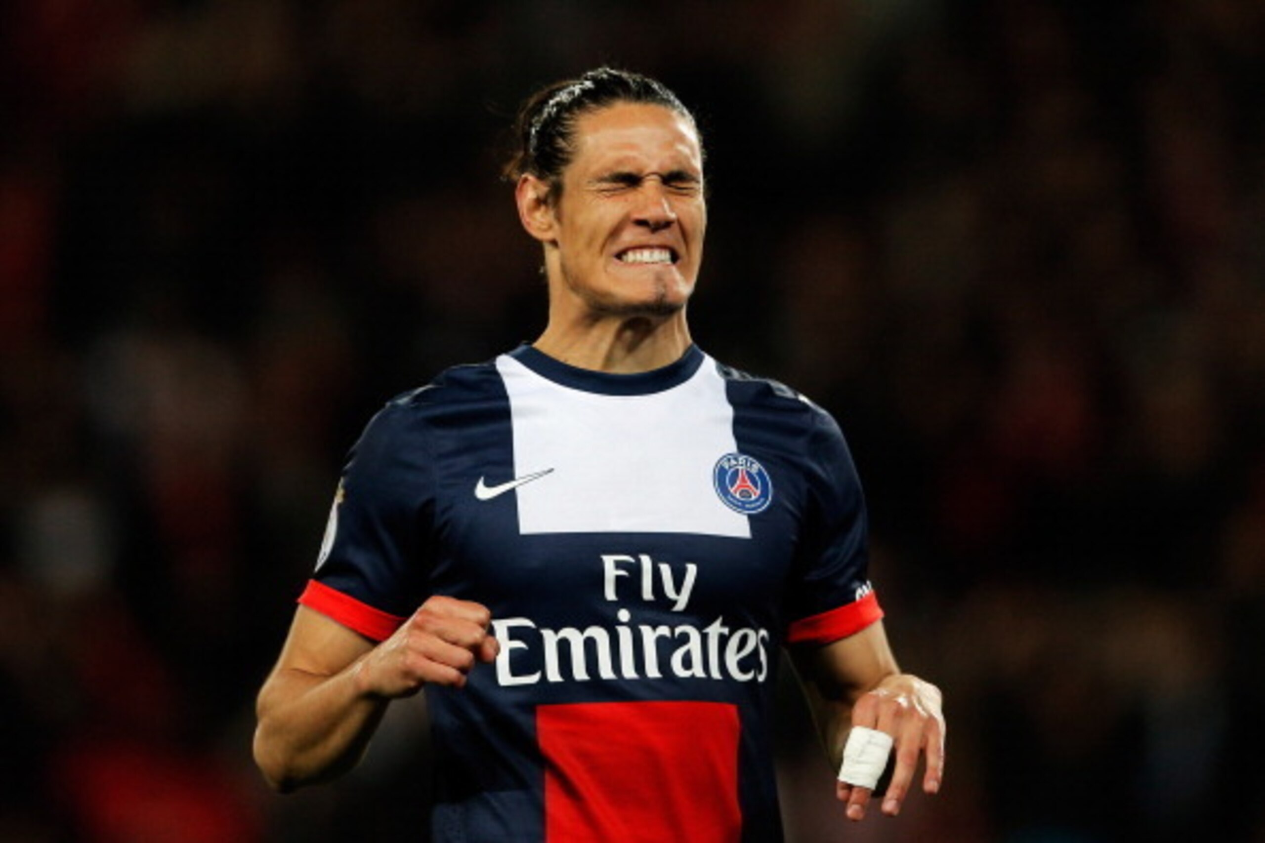 PARIS, FRANCE - MAY 07:  Edinson Cavani of PSG reacts to a missed chance on goal during the Ligue 1 match between Paris Saint-Germain FC and Stade Rennais FC at Parc des Princes on May 7, 2014 in Paris, France.  (Photo by Dean Mouhtaropoulos/Getty Images)