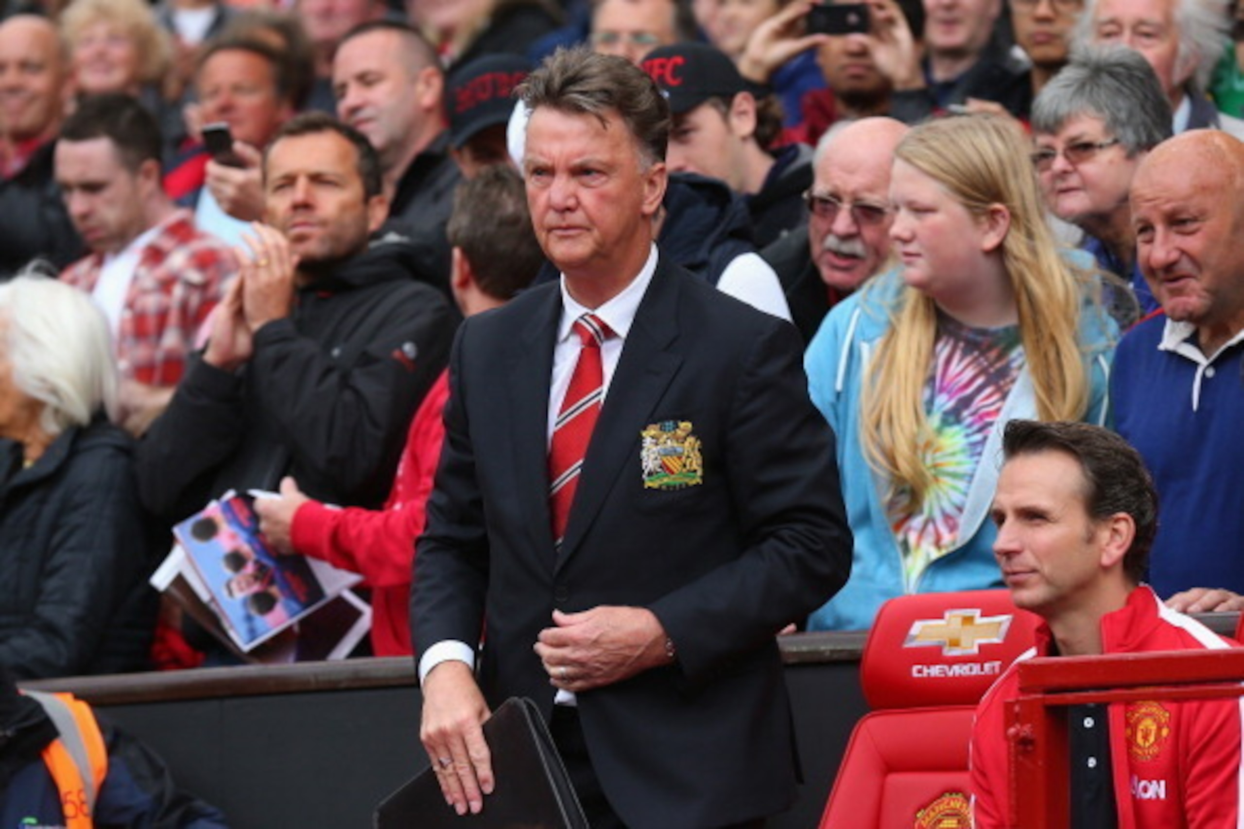 MANCHESTER, ENGLAND - AUGUST 16:  Manchester United Manager Louis van Gaal takes his seat prior to the Barclays Premier League match between Manchester United and Swansea City at Old Trafford on August 16, 2014 in Manchester, England.  (Photo by Alex Live