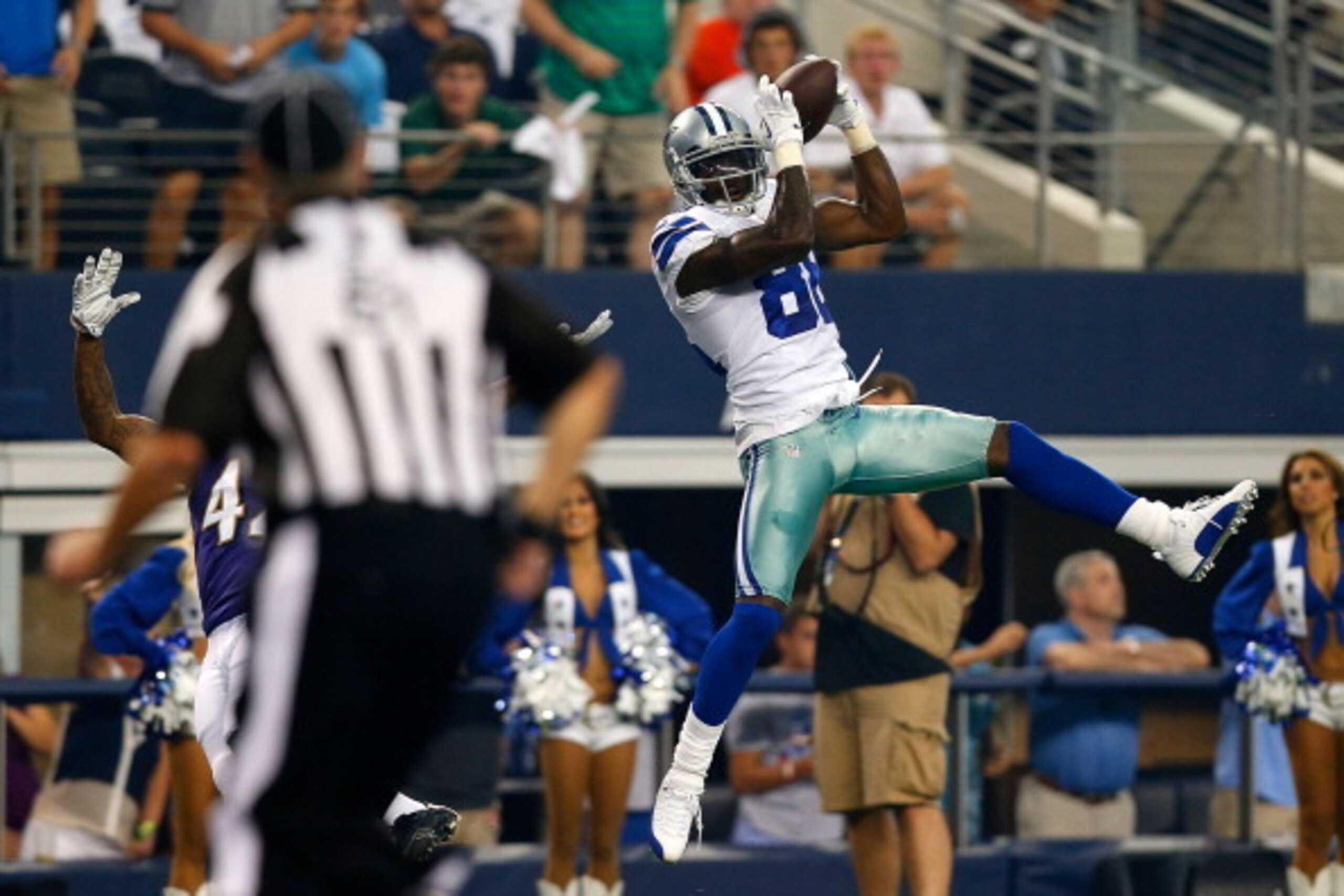 ARLINGTON, TX - AUGUST 16:  Dez Bryant #88 of the Dallas Cowboys makes the catch for a touchdown as Dominique Franks #42 of the Baltimore Ravens defends in the first half of their preseason game at AT&T Stadium on August 16, 2014 in Arlington, Texas.  (Ph