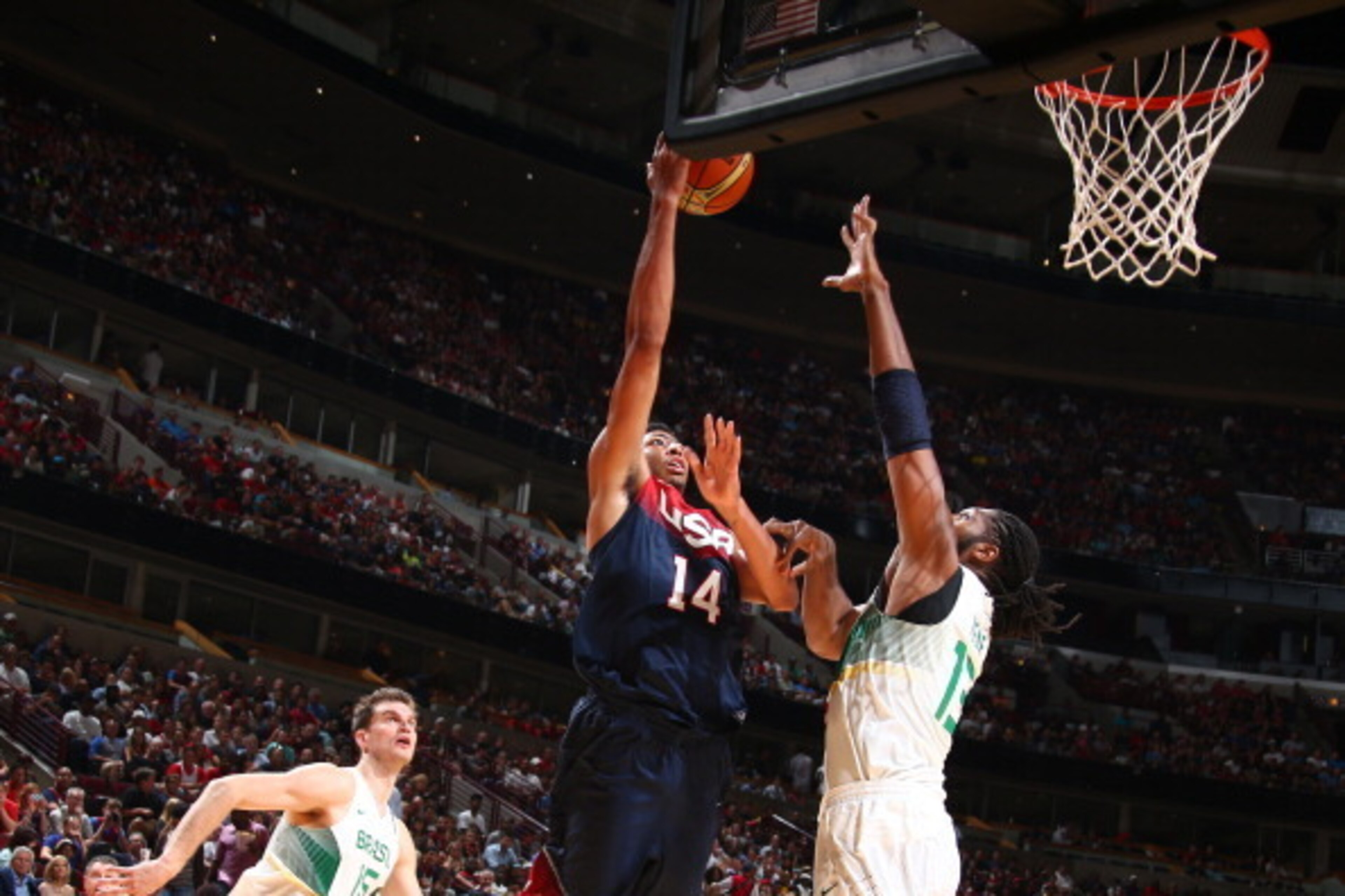 CHICAGO, IL - AUGUST 16: Anthony Davis #14 of the USA Basketball Men's National Team goes up to shoot against Nene #13 of the Brazil Basketball Men's National Team on August 16, 2014 at the United Center in Chicago, Illinois.  NOTE TO USER: User expressly
