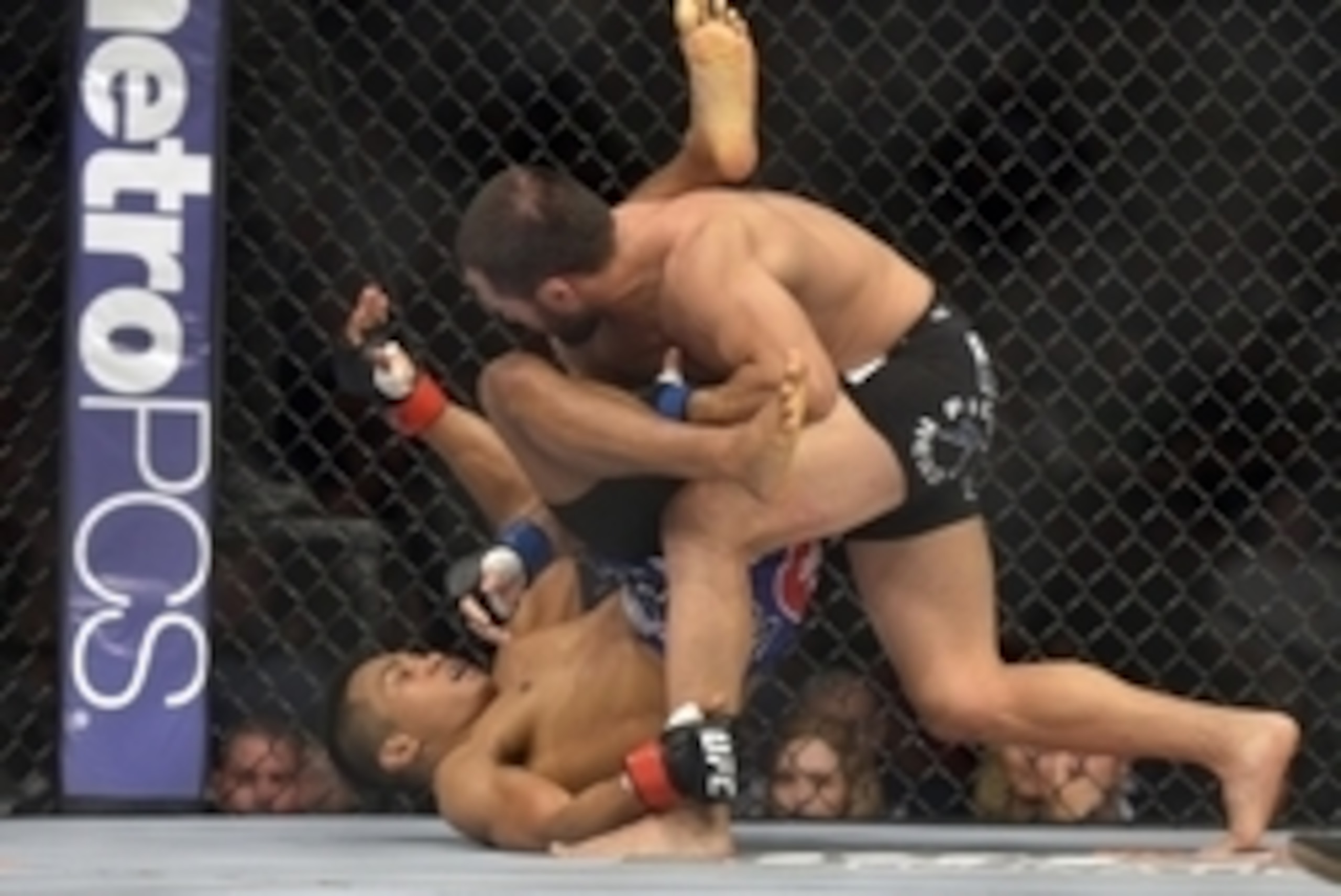 Aug 16, 2014; Bangor, ME, USA; Nolan Ticman (red gloves) fights Frankie Saenz (blue gloves) during a bantamweight bout during UFC Fight Night 47 at Cross Insurance Center. Mandatory Credit: Gregory J. Fisher-USA TODAY Sports