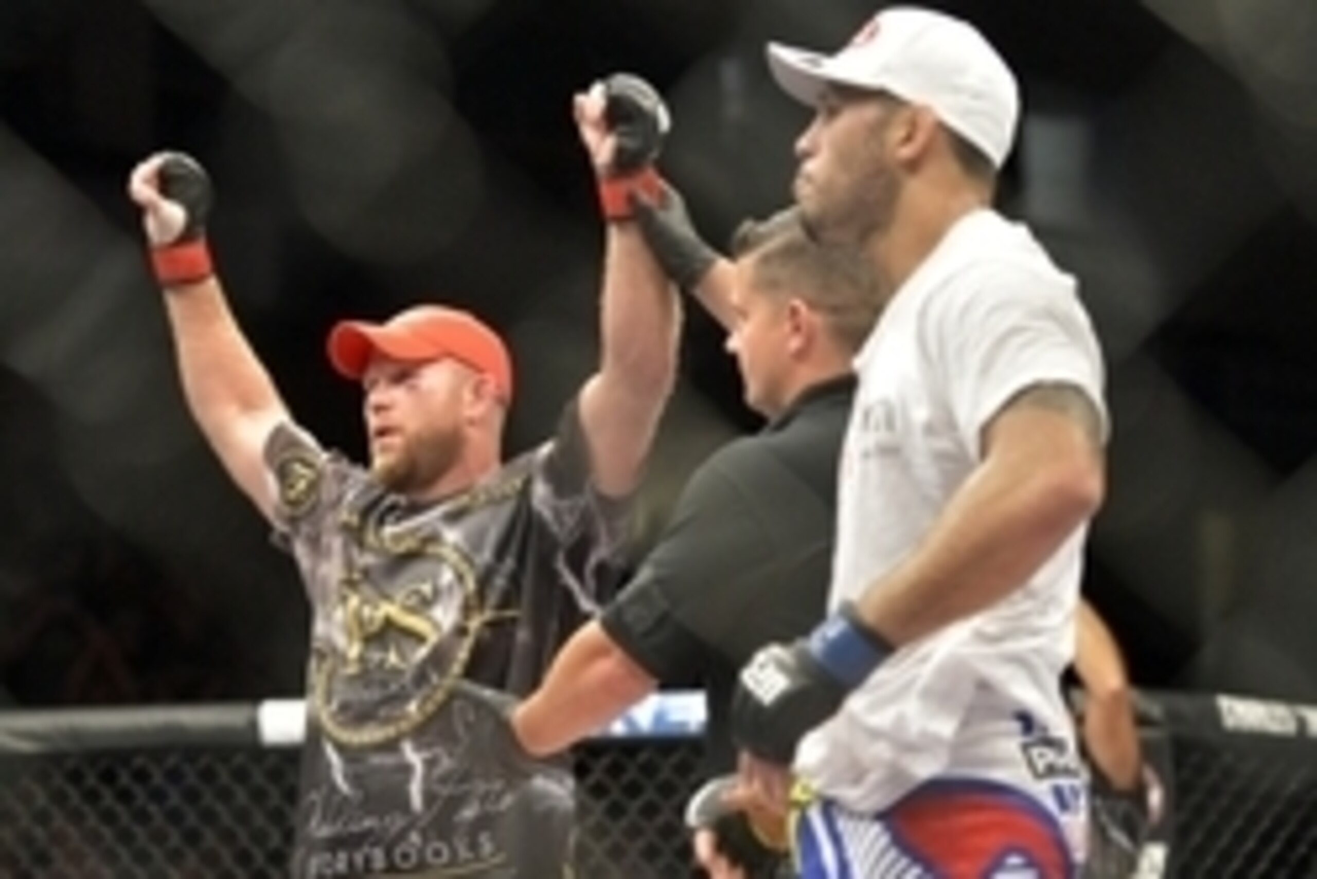 Aug 16, 2014; Bangor, ME, USA; Tim Boetsch (red gloves) is victorious over Brad Tavares (blue gloves) by knockout after their middleweight  bout in UFC Fight Night 47 at Cross Insurance Center. Mandatory Credit: Gregory J. Fisher-USA TODAY Sports