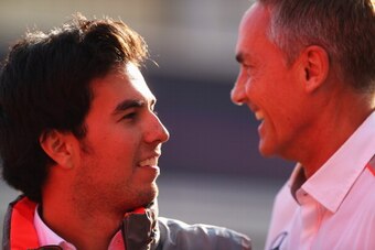 MONTMELO, SPAIN - MAY 11:  Sergio Perez of Mexico and McLaren shares a joke with his Team Principal Martin Whitmarsh as he leaves the paddock following qualifying for the Spanish Formula One Grand Prix at the Circuit de Catalunya on May 11, 2013 in Montme