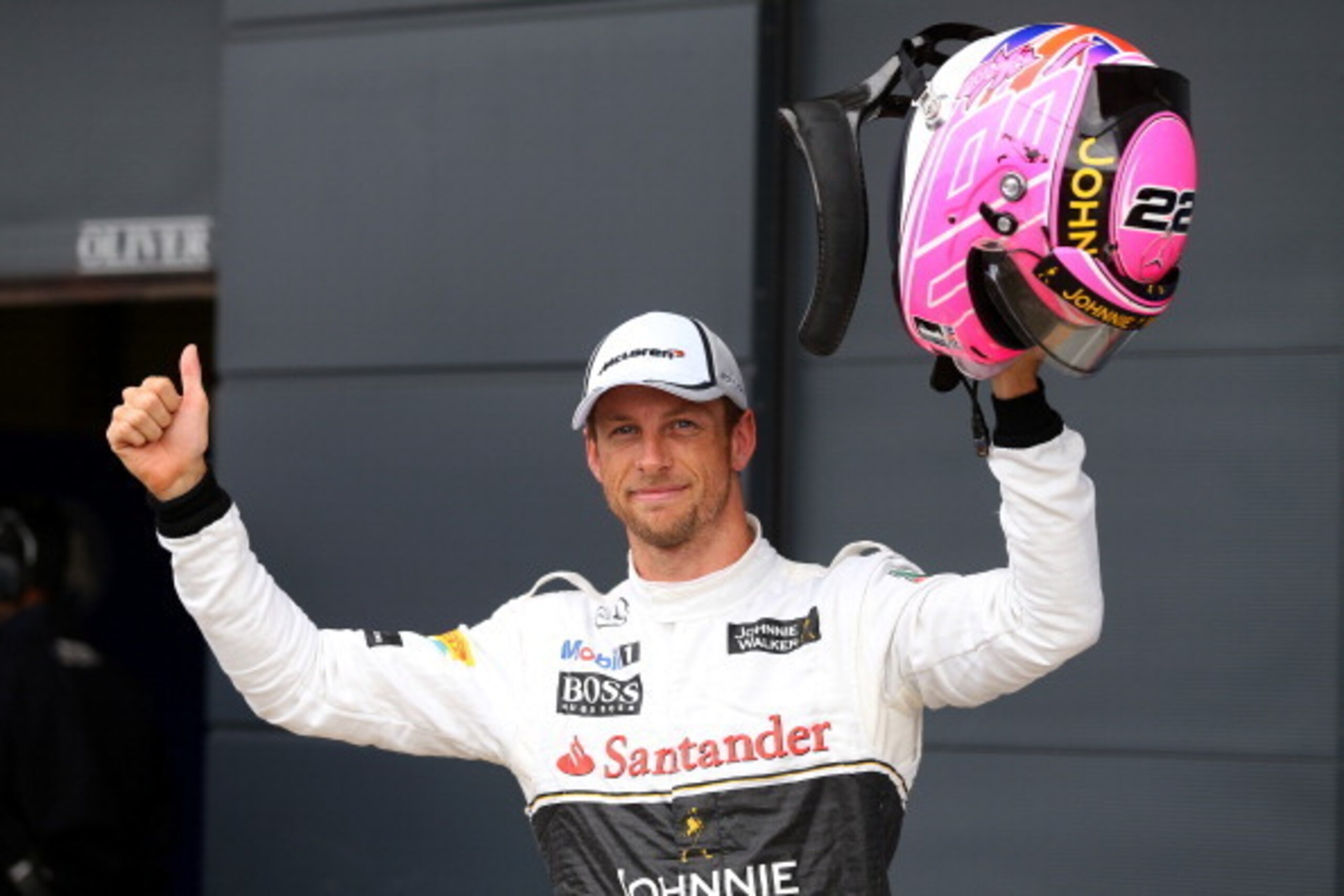 NORTHAMPTON, ENGLAND - JULY 05:  Jenson Button of Great Britain and McLaren celebrates in Parc Ferme after claiming third place on the grid during qualifying ahead of the British Formula One Grand Prix at Silverstone Circuit on July 5, 2014 in Northampton