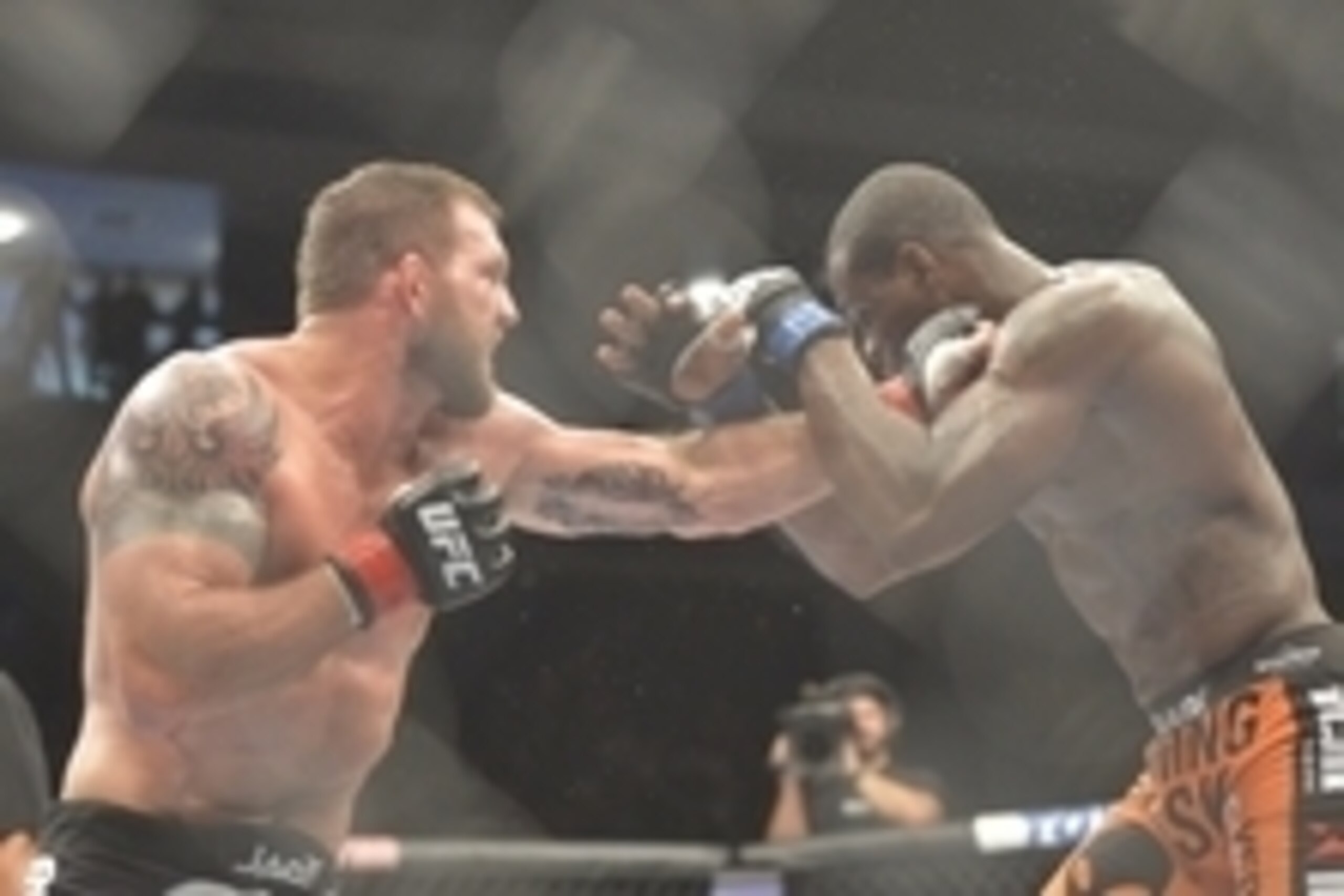 Aug 16, 2014; Bangor, ME, USA; Ryan Bader (red gloves) fights Ovince Saint Preux (blue gloves) during light heavyweight bout at Cross Insurance Center. Mandatory Credit: Gregory J. Fisher-USA TODAY Sports