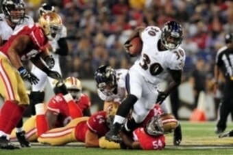 Aug 7, 2014; Baltimore, MD, USA; Baltimore Ravens running back Bernard Pierce (30) gets tackled by San Francisco 49ers linebacker Nick Moody (54) in the second quarter at M&T Bank Stadium. Mandatory Credit: Evan Habeeb-USA TODAY Sports
