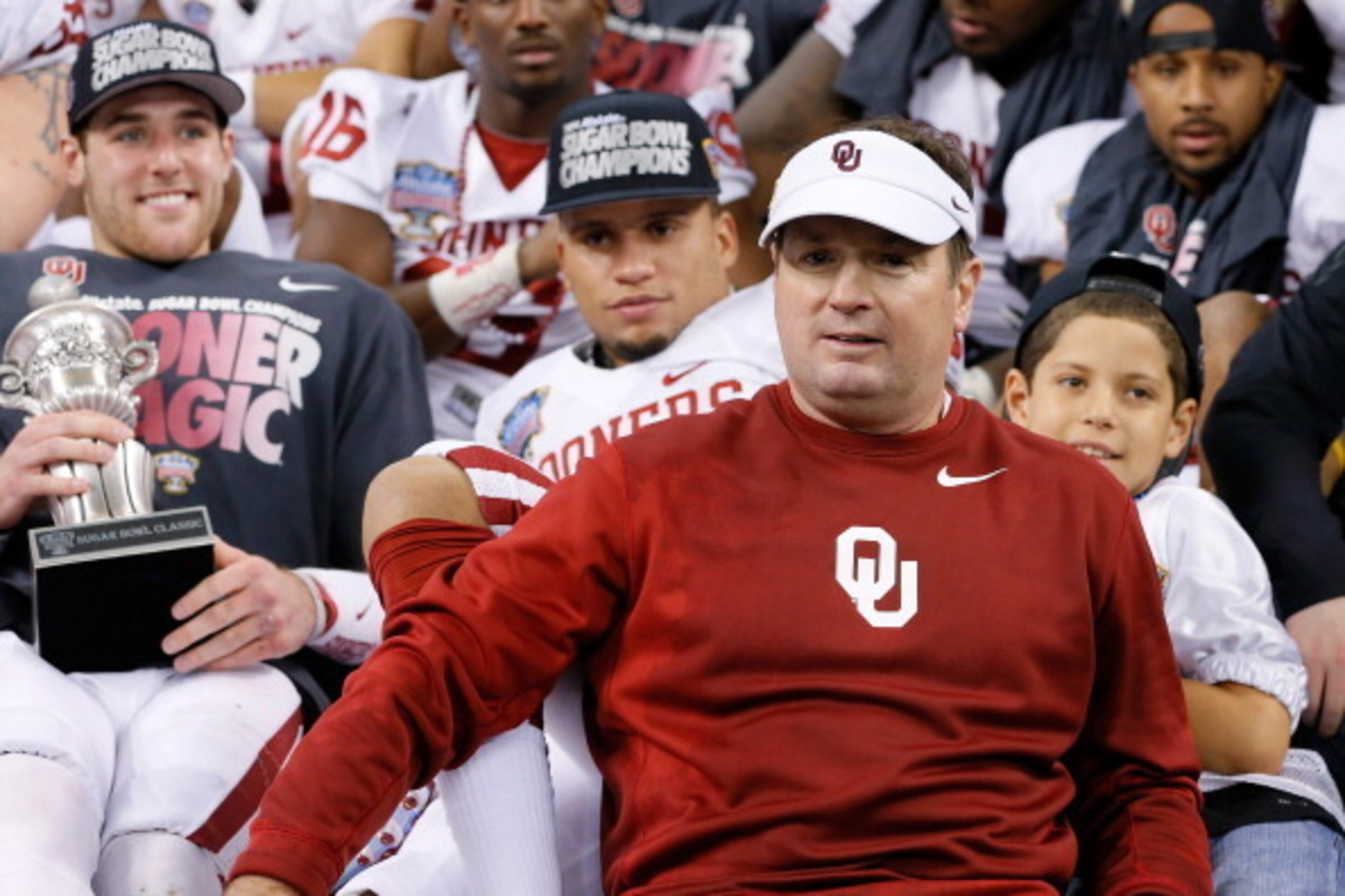 NEW ORLEANS, LA - JANUARY 02:  Head coach Bob Stoops and MVP Trevor Knight #9 of the Oklahoma Sooners celebrate after their 45-31 win over the Alabama Crimson Tide during the Allstate Sugar Bowl at the Mercedes-Benz Superdome on January 2, 2014 in New Orl