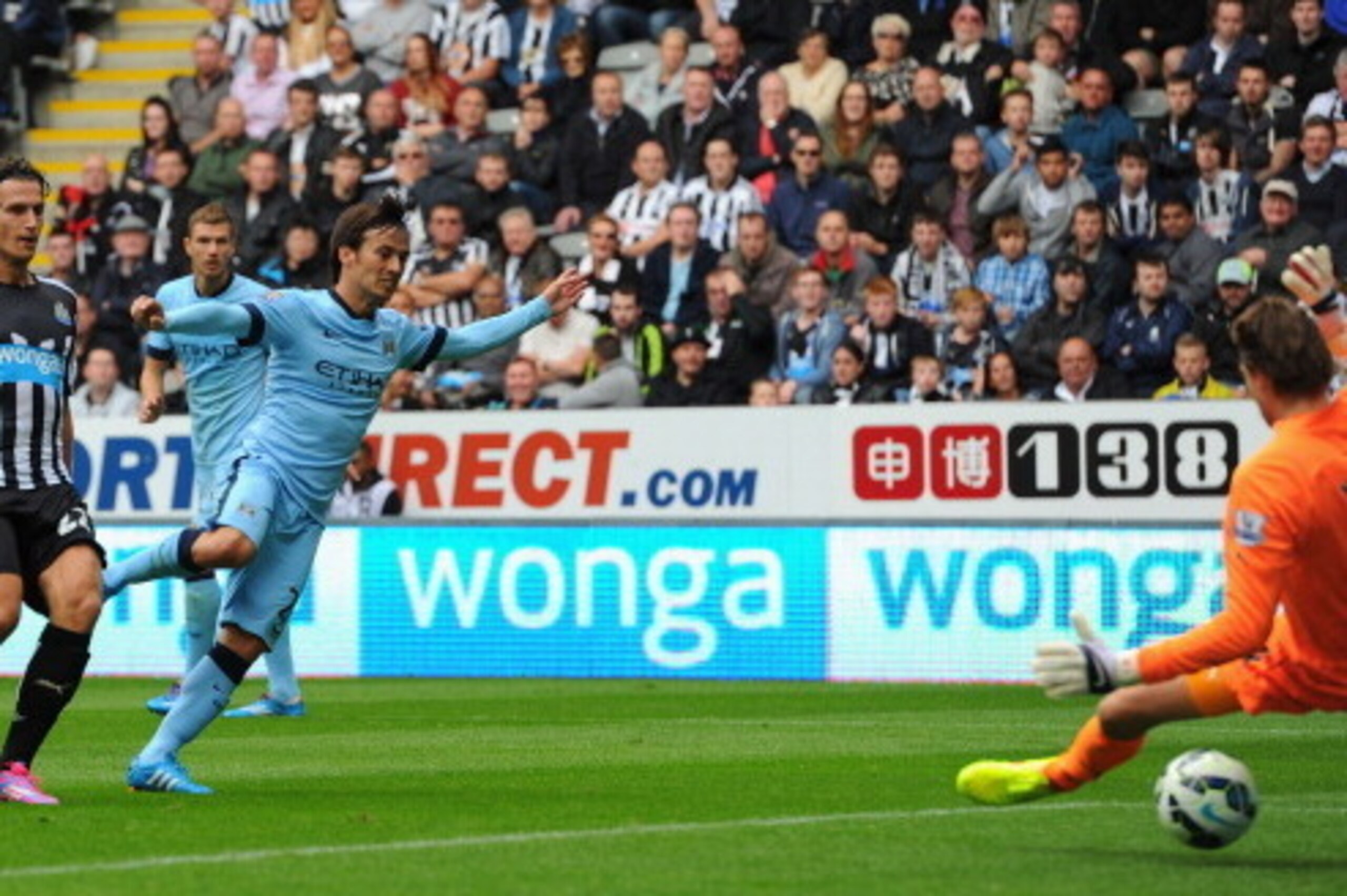 NEWCASTLE UPON TYNE, ENGLAND - AUGUST 17:  David Silva of Man City scores the opening goal during the Barclays Premier League match between Newcastle United and Manchester City at St James' Park on August 17, 2014 in Newcastle upon Tyne, England.  (Photo 
