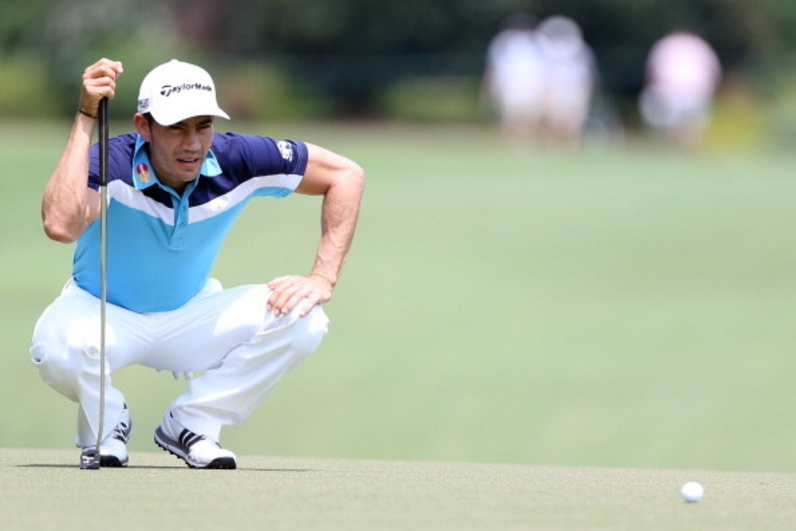 GREENSBORO, NC - AUGUST 17:  Camilo Villegas of Colombia lines up a putt on the first hole during the final round of the Wyndham Championship at Sedgefield Country Club on August 17, 2014 in Greensboro, North Carolina.  (Photo by Todd Warshaw/Getty Images