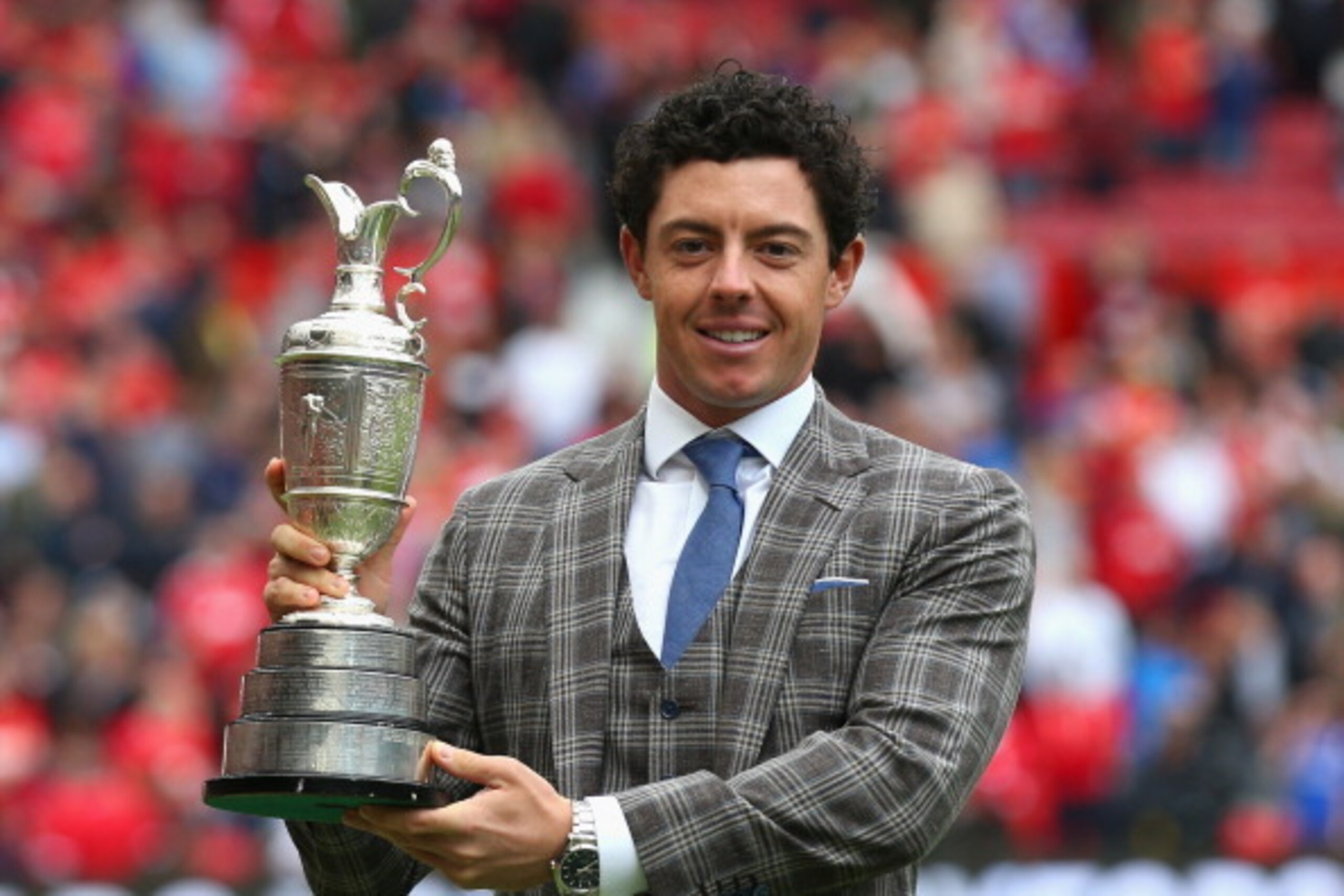 MANCHESTER, ENGLAND - AUGUST 16:  Golfer Rory McIlroy of Northern Ireland poses with the Claret Jug at half-time during the Barclays Premier League match between Manchester United and Swansea City at Old Trafford on August 16, 2014 in Manchester, England.