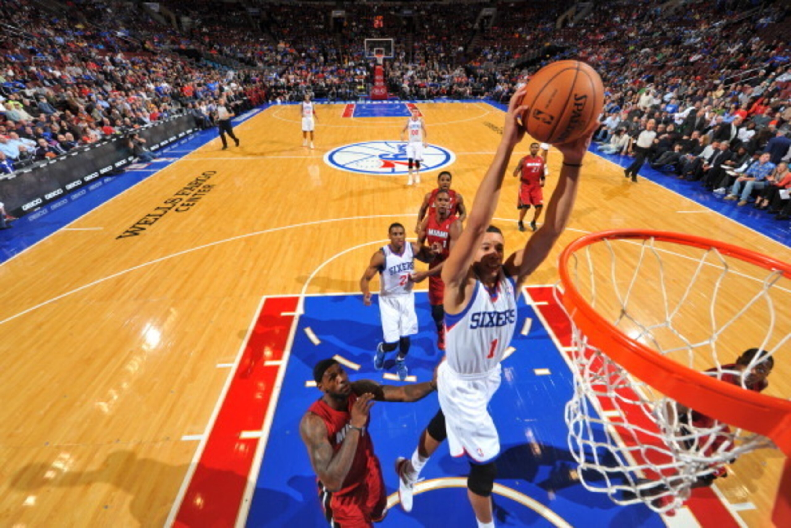 PHILADELPHIA, PA - OCTOBER 30: Michael Carter Williams #1 of the Philadelphia 76ers drives for a dunk against LeBron James #6 of the Miami Heat at the Wells Fargo Center on October 30, 2013 in Philadelphia, Pennsylvania. NOTE TO USER: User expressly ackno