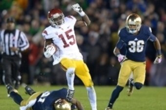 Oct 19, 2013; South Bend, IN, USA; Southern California Trojans receiver Nelson Agholor (15) is pursued by Notre Dame Fighting Irish safety Matthias Farley (41) and cornerback Cole Luke (36) at Notre Dame Stadium. Notre Dame won 14-10. Mandatory Credit: Ki