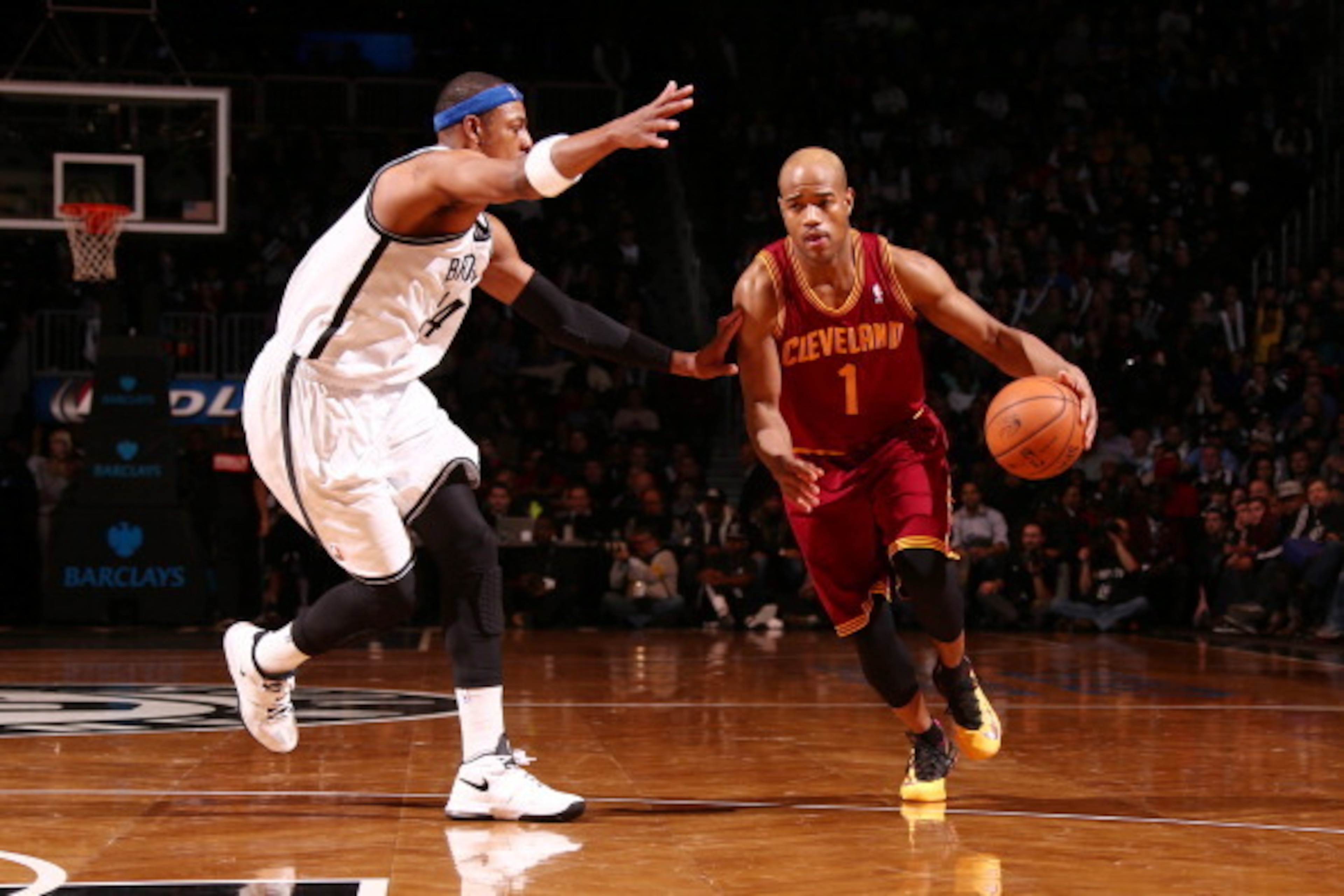 NEW YORK, NY - JANUARY 04: Jarrett Jack #1 of the Cleveland Cavaliers dribbles against Paul Pierce #34 of the Brooklyn Nets during a game at the Barclays Center on January 4, 2014 in the Brooklyn borough of New York City.  NOTE TO USER: User expressly ack
