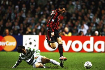 GLASGOW, UNITED KINGDOM - FEBRUARY 20: Shunsuke Nakamura of Celtic tackles Yoann Gourcuff of AC Milan during the UEFA Champions League Round 16, first leg match between Celtic and AC Milan at Celtic Park  February 20, 2007 in Glasgow, Scotland.  (Photo by