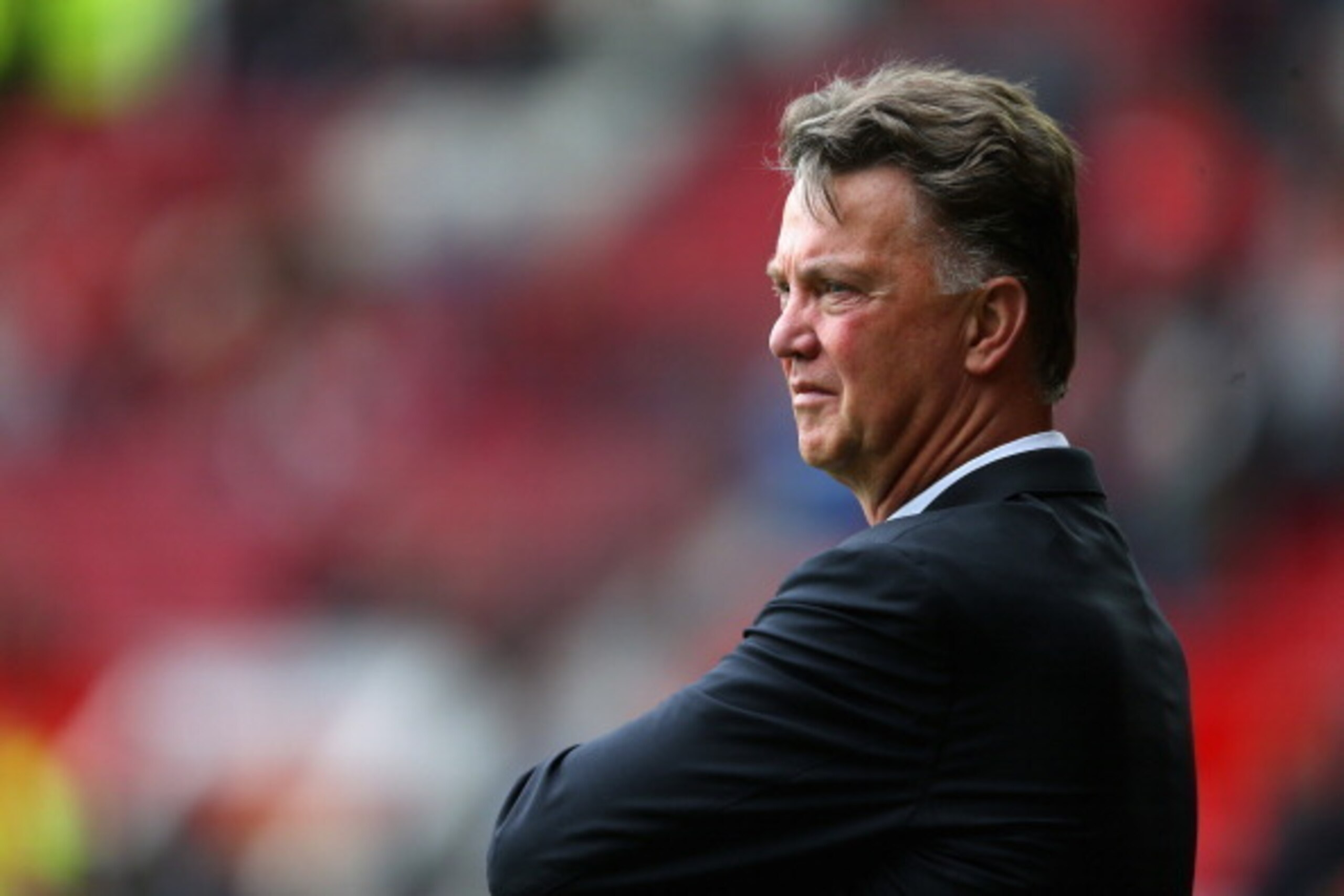 MANCHESTER, ENGLAND - AUGUST 16:  Manchester United Manager Louis van Gaal looks on prior to the Barclays Premier League match between Manchester United and Swansea City at Old Trafford on August 16, 2014 in Manchester, England.  (Photo by Alex Livesey/Ge