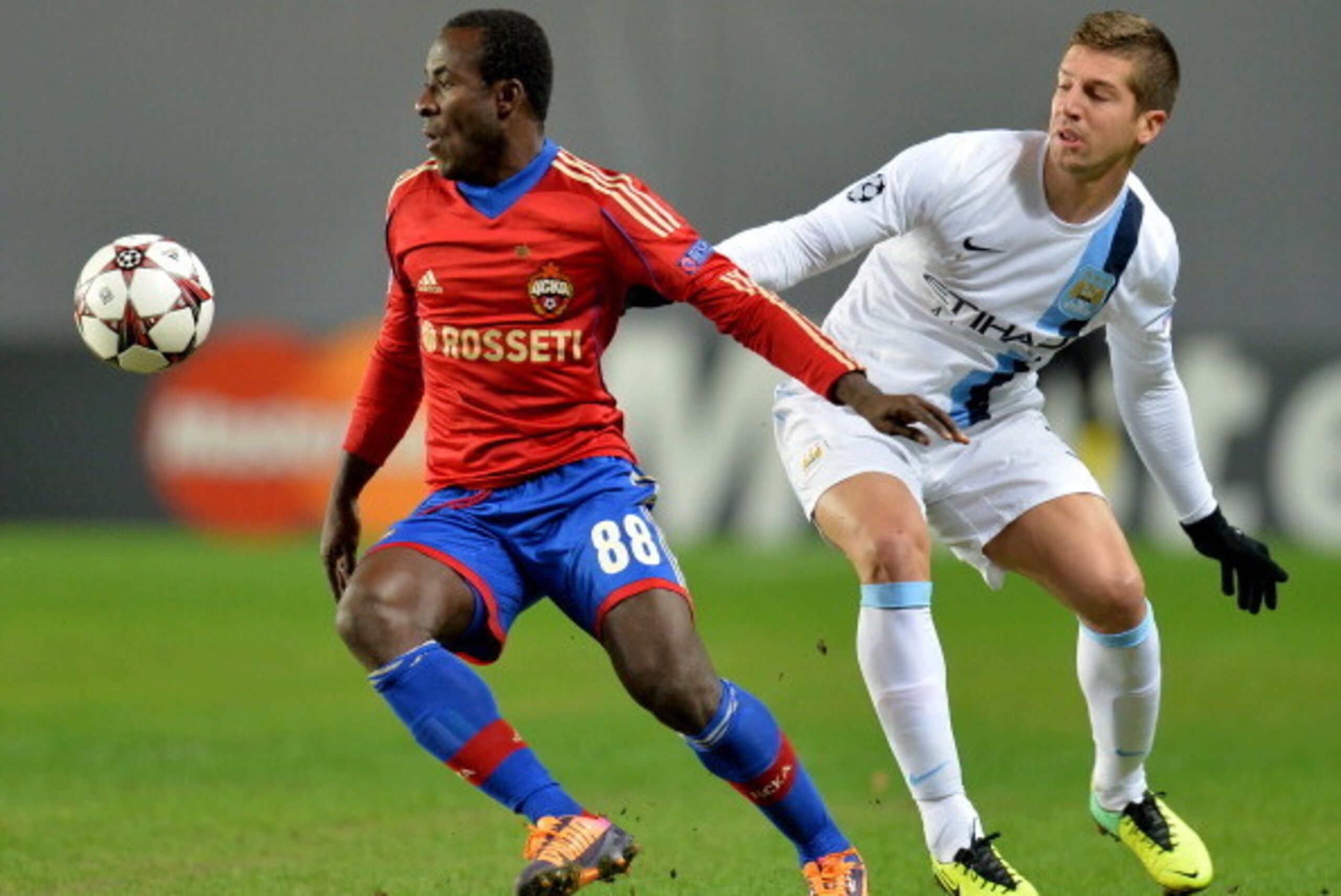 KHIMKI, RUSSIA - OCTOBER 23: Seydou Doumbia (L) of PFC CSKA Moscow in action against Matija Nastasic of Manchester City FC during the UEFA Champions League Group D match between PFC CSKA Moscow and Manchester City FC at the Arena Khimki Stadium on October