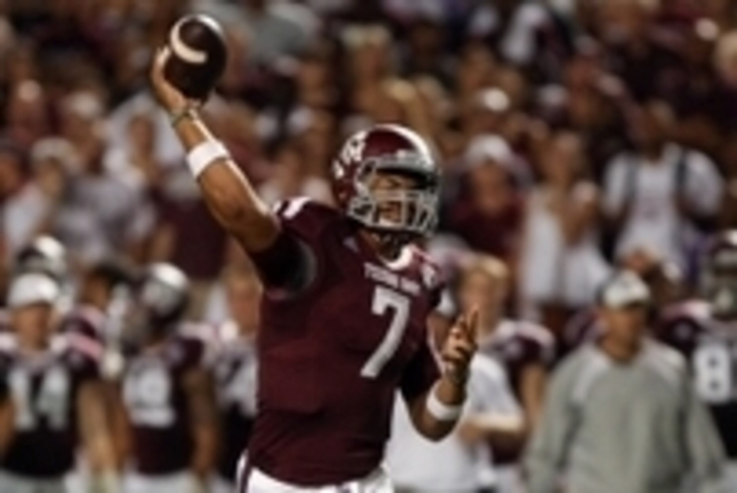 Sep 7, 2013; College Station, TX, USA; Texas A&M Aggies quarterback Kenny Hill (7) throws a touchdown pass during the third quarter against the Sam Houston State Bearkats at Kyle Field. Mandatory Credit: Troy Taormina-USA TODAY Sports