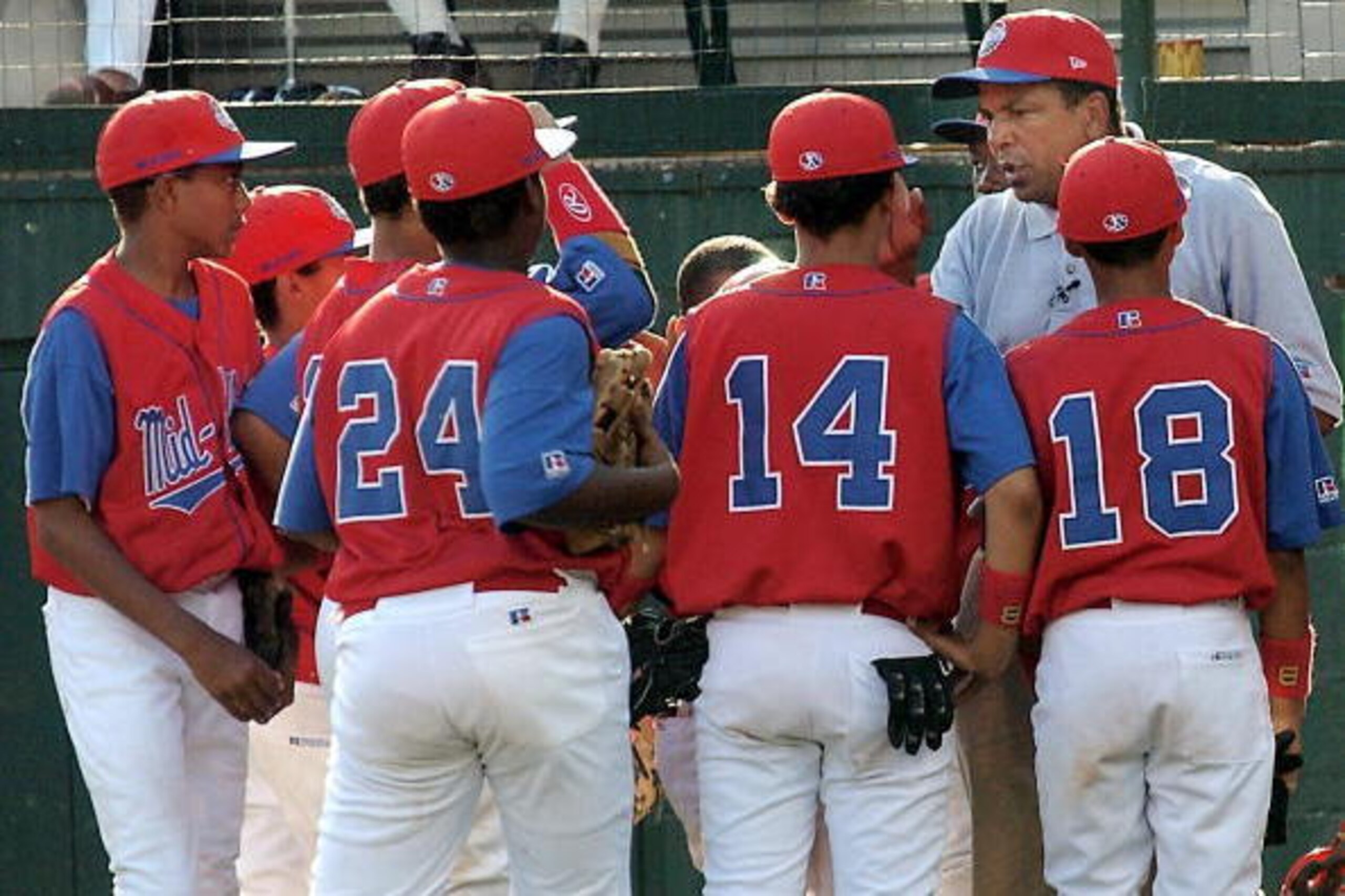 WILLIAMSPORT, PA - AUGUST 20:  Manager Morris McWilliams, of the Harlem, New York team, rallies his team between innings in the Little League World Series tournament August 20, 2002 in Williamsport, Pennsylvania. Harlem went on to win 5-2,  advancing to t