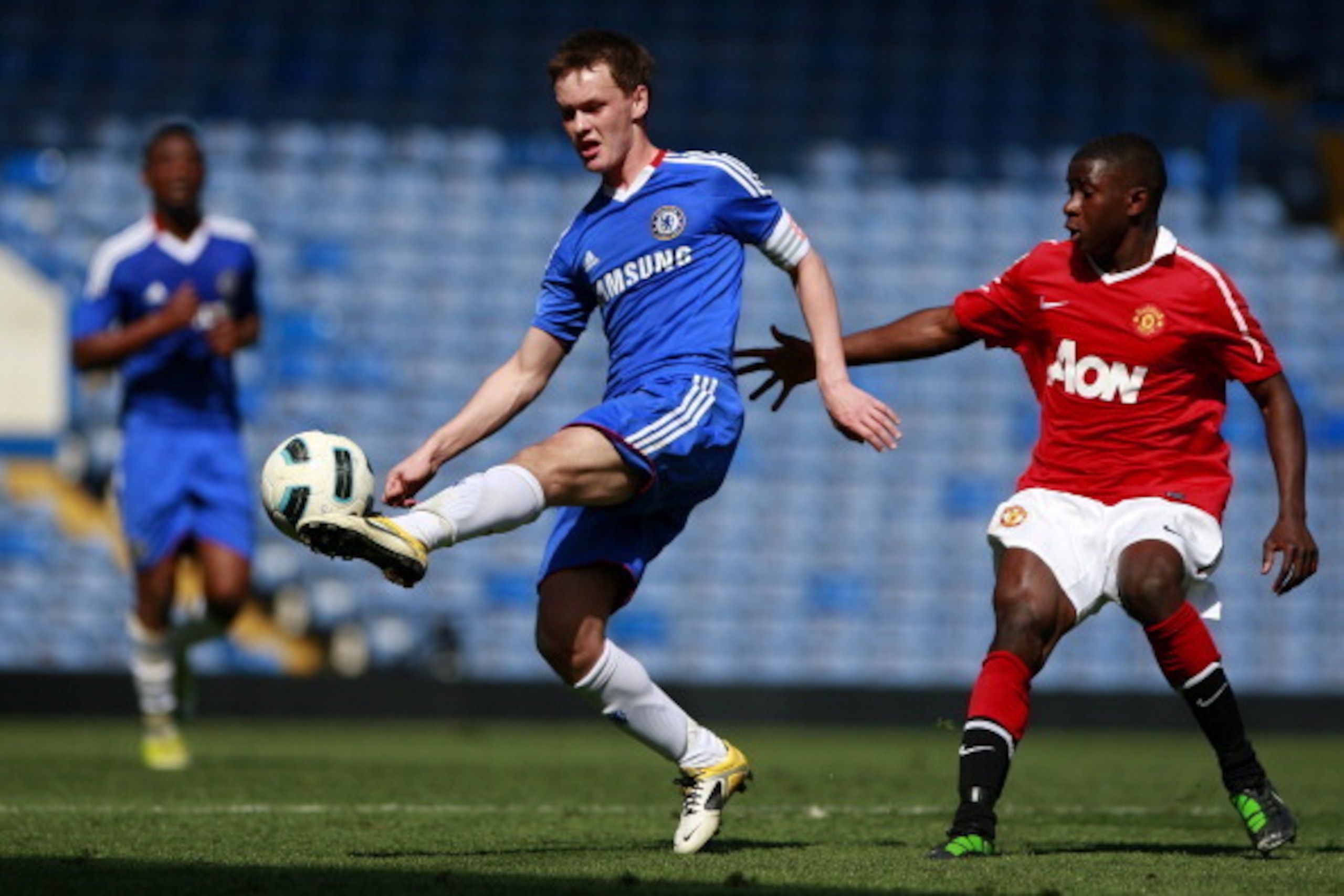LONDON, ENGLAND - APRIL 10:  Joshua McEachran (C) of Chelsea in action against Larnell Cole of Manchester United during the FA Youth Cup sponsored by E.on semi final first leg match between Chelsea and Manchester United at Stamford Bridge on April 10, 201