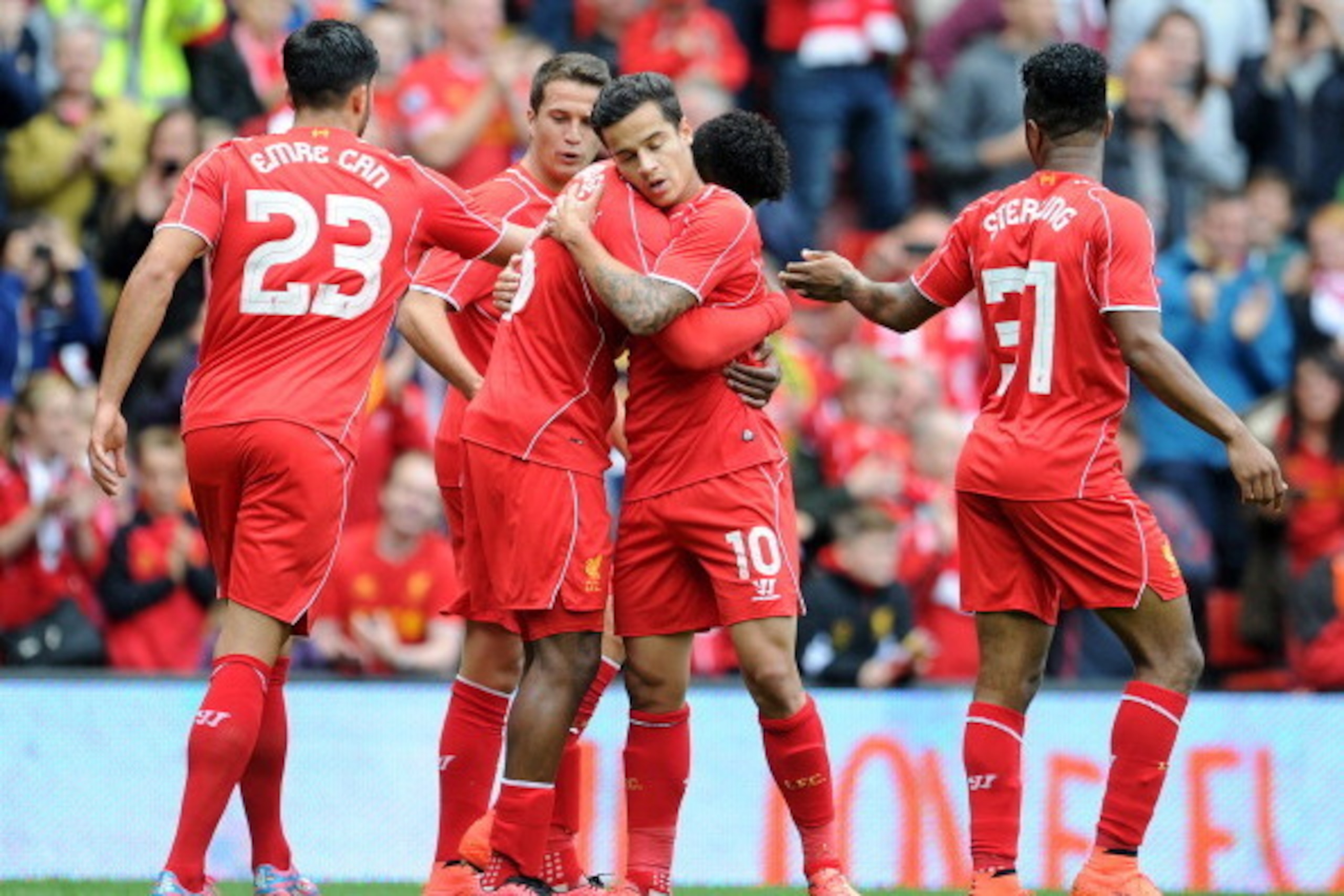 LIVERPOOL, ENGLAND - AUGUST 10:  Daniel Sturridge (C) of Liverpool celebrates with team-mate Philippe Coutinho after he scores the first goal of the game for his side during the Pre Season Friendly match between Liverpool and Borussia Dortmund at Anfield 