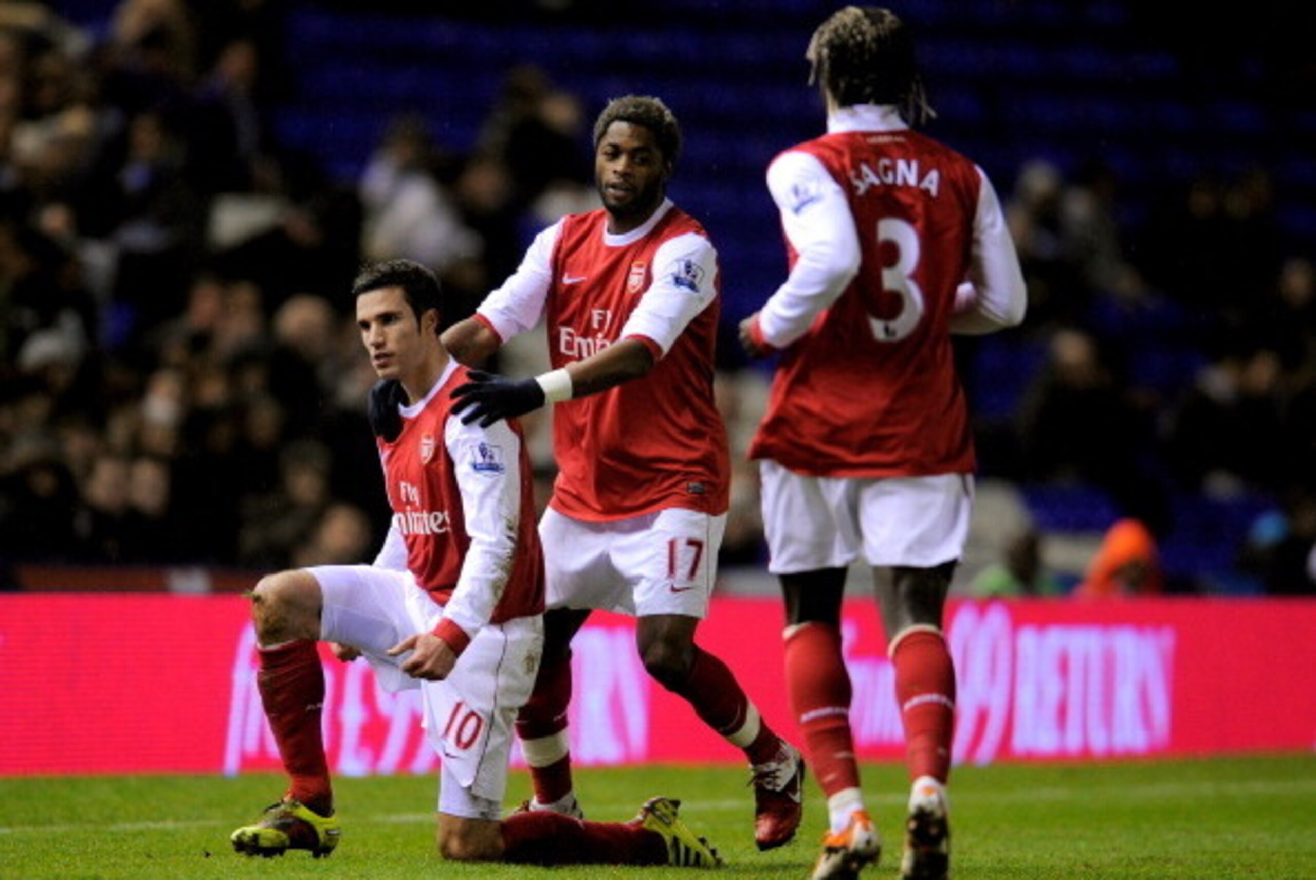 BIRMINGHAM, ENGLAND - JANUARY 01:  Robin Van Persie (L) of Arsenal is congratulated by teammates Alex Song (C) and Bacary Sagna (R) after scoring the opening goal of the match during the Barclays Premier Leaue match between Birmingham City and Arsenal at 