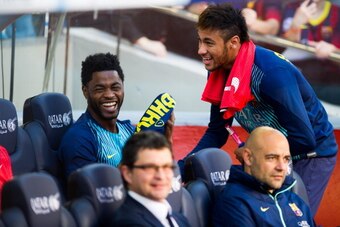 BARCELONA, SPAIN - MARCH 16: Alex Song and Neymar Santos Jr of FC Barcelona share a laugh on the bench during the La Liga match between FC Barcelona and CA Osasuna at Camp Nou on March 16, 2014 in Barcelona, Spain. (Photo by Alex Caparros/Getty Images)