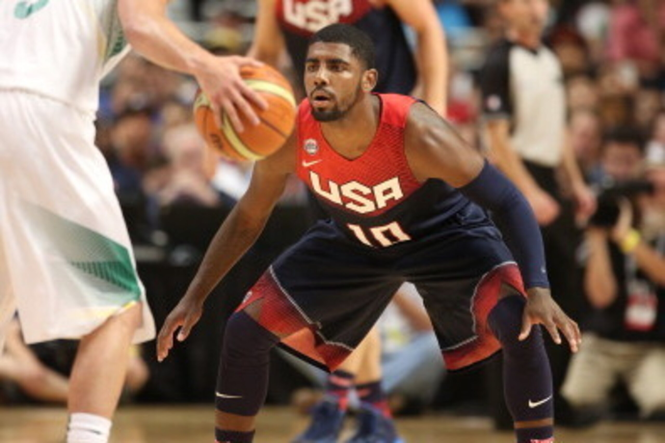 CHICAGO, IL - AUGUST 16: Kyrie Irving #10 of the USA Basketball Men's National Team defends against Raul Neto #5 of the Brazil National Team on August 16, 2014 at the United Center in Chicago, Illinois.  NOTE TO USER: User expressly acknowledges and agree