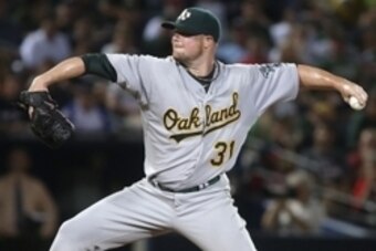 Aug 17, 2014; Atlanta, GA, USA; Oakland Athletics starting pitcher Jon Lester (31) delivers a pitch to an Atlanta Braves batter in the second inning of their game at Turner Field. Mandatory Credit: Jason Getz-USA TODAY Sports