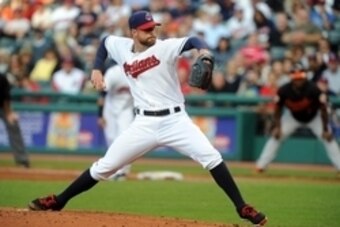 Aug 15, 2014; Cleveland, OH, USA; Cleveland Indians starting pitcher Corey Kluber (28) pitches during the third inning against the Baltimore Orioles at Progressive Field. Mandatory Credit: Ken Blaze-USA TODAY Sports