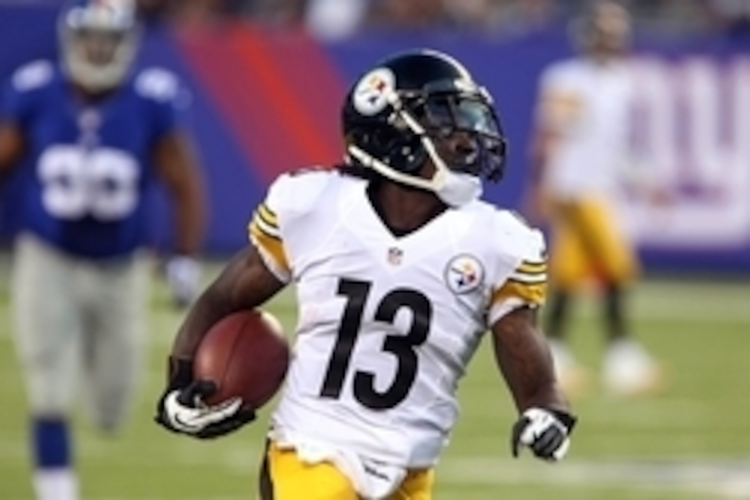 Aug 9, 2014; East Rutherford, NJ, USA;  Pittsburgh Steelers running back Dri Archer (13) rushes for a first down against the New York Giants during first quarter  at MetLife Stadium. Mandatory Credit: Noah K. Murray-USA TODAY Sports