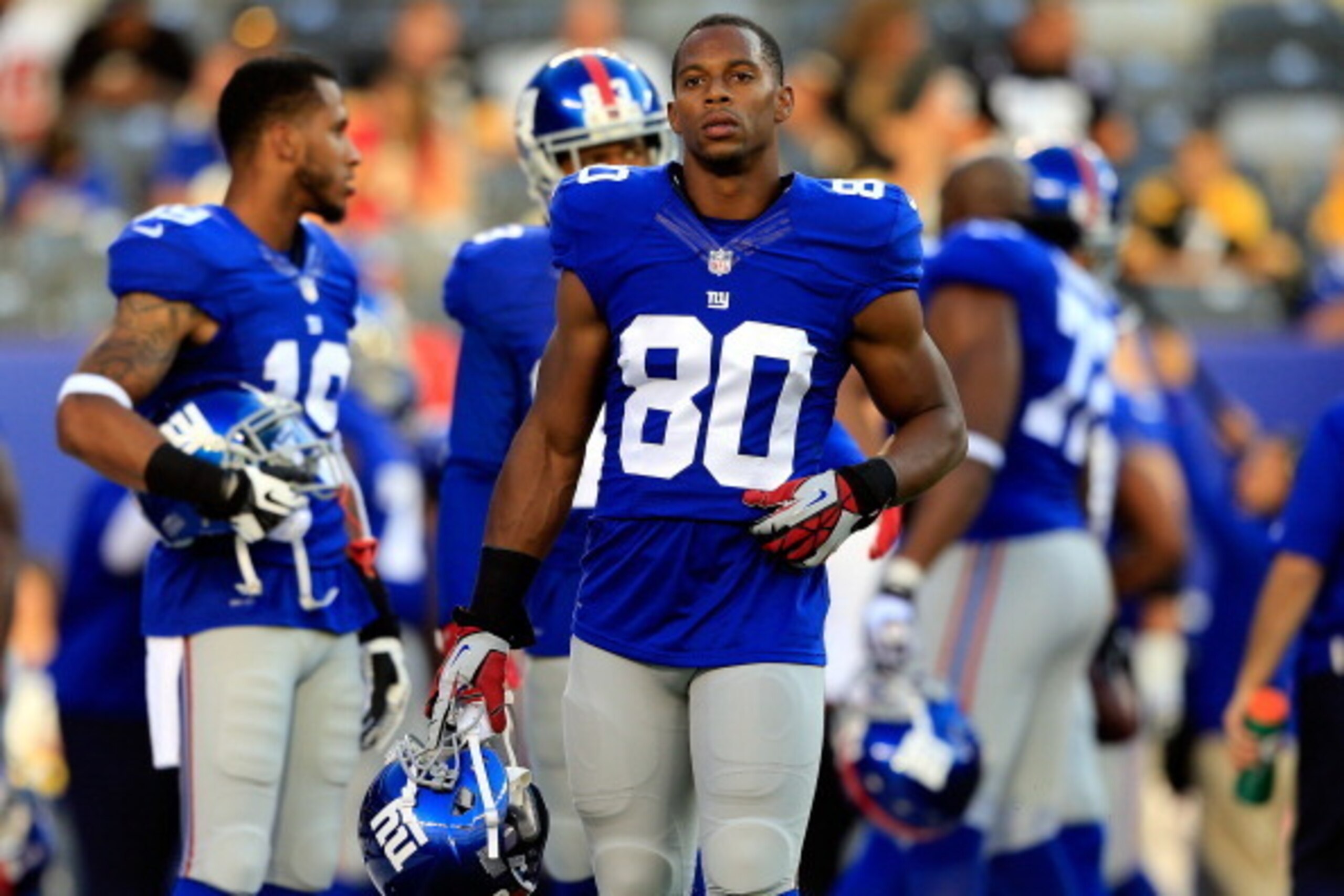 EAST RUTHERFORD, NJ - AUGUST 09: Wide receiver Victor Cruz #80 of the New York Giants looks on prior to a preseason game against the Pittsburgh Steelers at MetLife Stadium on August 9, 2014 in East Rutherford, New Jersey.  (Photo by Alex Trautwig/Getty Im