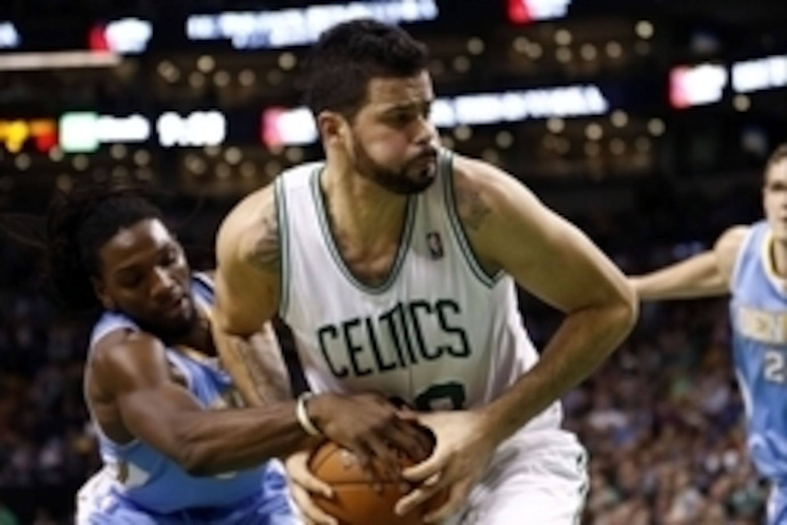 Dec 6, 2013; Boston, MA, USA; Boston Celtics center Vitor Faverani (right) fights for the ball against Denver Nuggets power forward Kenneth Faried (left) during the second half at TD Garden. Mandatory Credit: Mark L. Baer-USA TODAY Sports