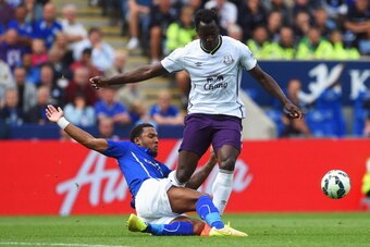LEICESTER, ENGLAND - AUGUST 16: Romelu Lukaku of Everton is tackled by Liam Moore of Leicester City during the Barclays Premier League match between Leicester City and Everton at the King Power Stadium on August 16, 2014 in Leicester, England.  (Photo by 