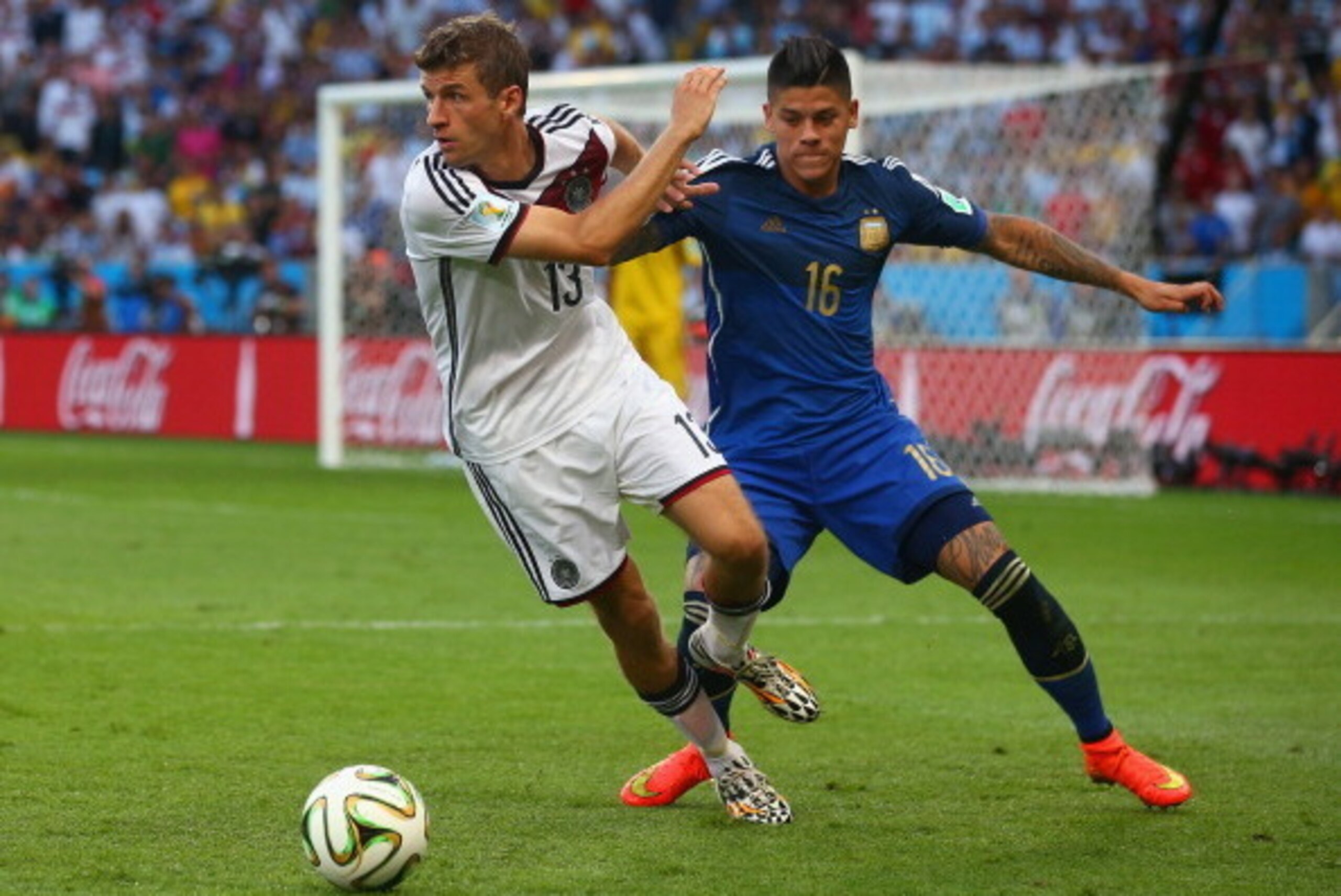 RIO DE JANEIRO, BRAZIL - JULY 13: Marcos Rojo of Argentina challenges Thomas Mueller of Germany during the 2014 FIFA World Cup Brazil Final match between Germany and Argentina at Maracana on July 13, 2014 in Rio de Janeiro, Brazil. (Photo by Julian Finne RIO DE JANEIRO, BRAZIL - JULY 13: Marcos Rojo of Argentina challenges Thomas Mueller of Germany during the 2014 FIFA World Cup Brazil Final match between Germany and Argentina at Maracana on July 13, 2014 in Rio de Janeiro, Brazil. (Photo by Julian Finne