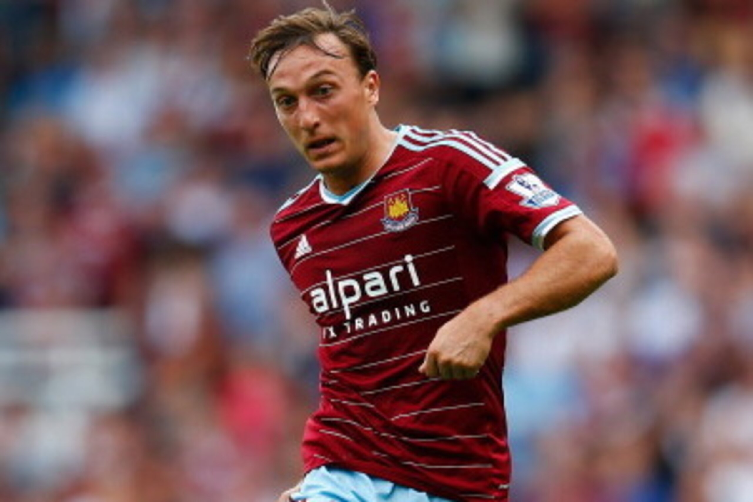 LONDON, ENGLAND - AUGUST 16:  Mark Noble of West Ham in action during the Premier League match between West Ham United and Tottenham Hotspur at Boleyn Ground on August 16, 2014 in London, England.  (Photo by Julian Finney/Getty Images)