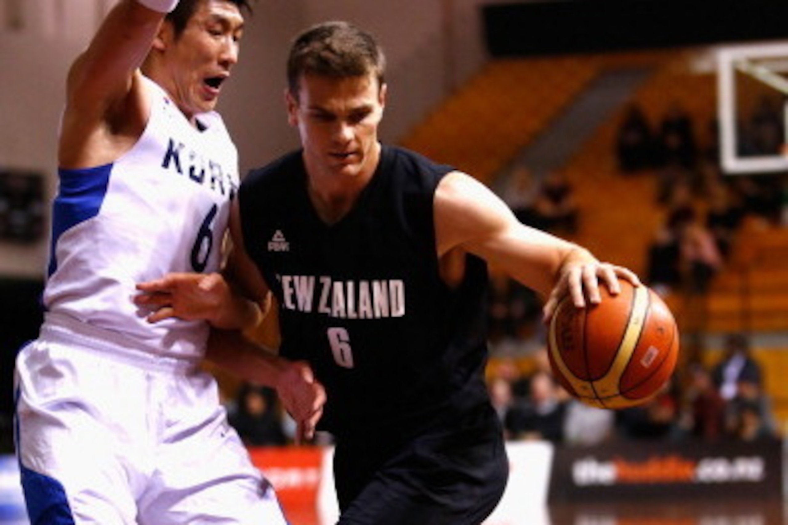 AUCKLAND, NEW ZEALAND - JULY 19:  Kirk Penney of New Zealand takes the ball forward during the international match between the New Zealand Tall Blacks and South Korea at North Shore Events Centre on July 19, 2014 in Auckland, New Zealand.  (Photo by Phil 