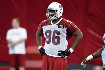 TEMPE, AZ - MAY 23:  Kareem Martin #96 of the Arizona Cardinals gets ready prior to a defensive drill during Rookie Minicamp practice on May 23, 2014 in Tempe, Arizona.  (Photo by Norm Hall/Getty Images)