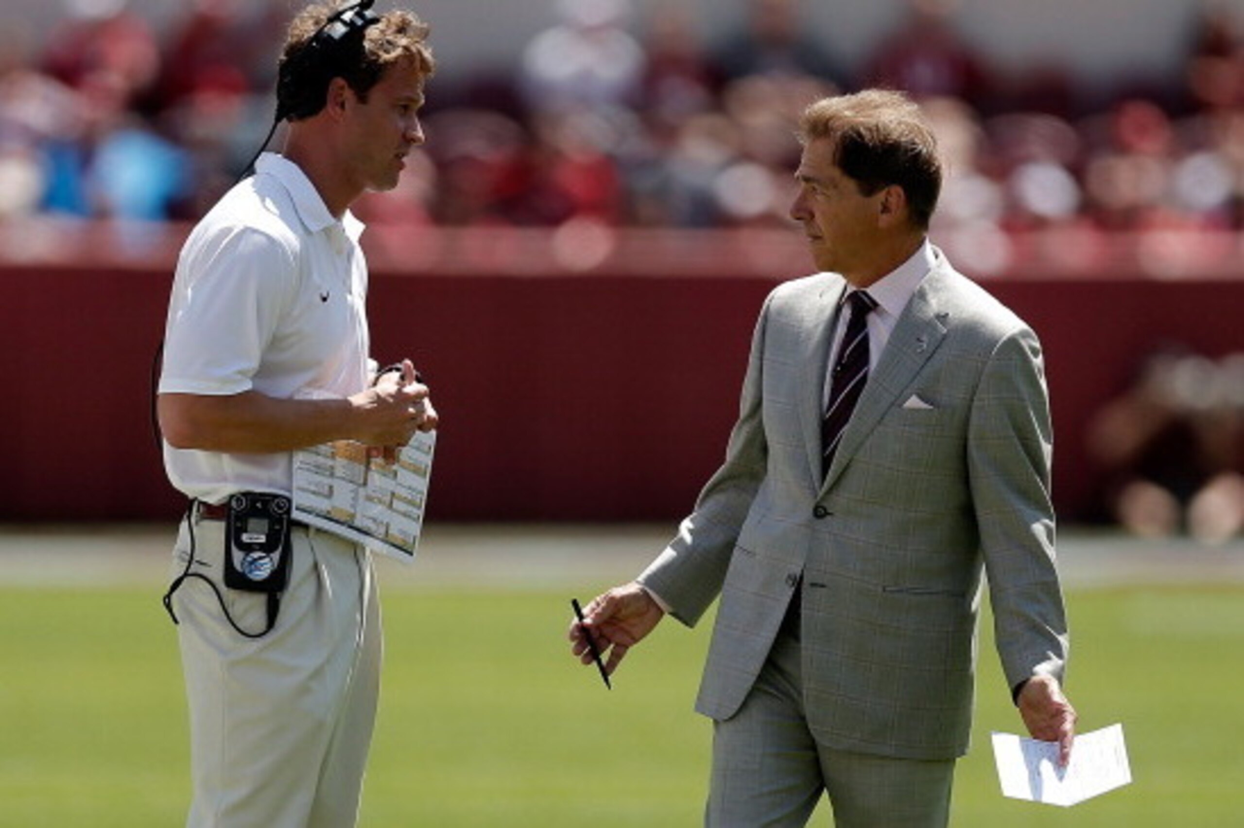 TUSCALOOSA, AL - APRIL 19:  Head coach Nick Saban of the Alabama Crimson Tide speaks with offensive coordinator Lane Kiffin during the Alabama A-Day spring game at Bryant-Denny Stadium on April 19, 2014 in Tuscaloosa, Alabama.  (Photo by Stacy Revere/Gett