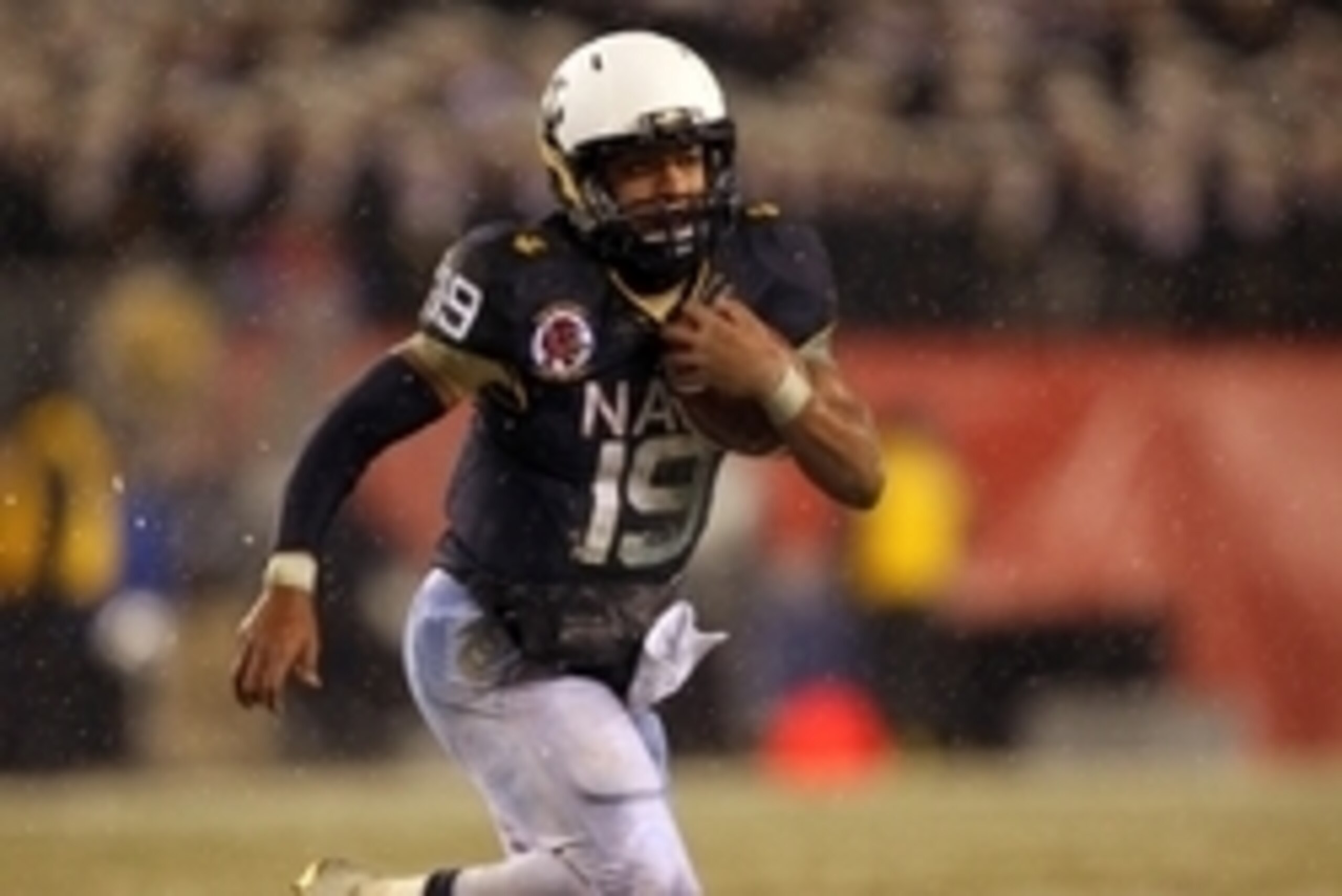 Dec 14, 2013; Philadelphia, PA, USA; Navy Midshipmen quarterback Keenan Reynolds (19) runs with the ball against Army during the second half at Lincoln Financial Field. Mandatory Credit: Danny Wild-USA TODAY Sports