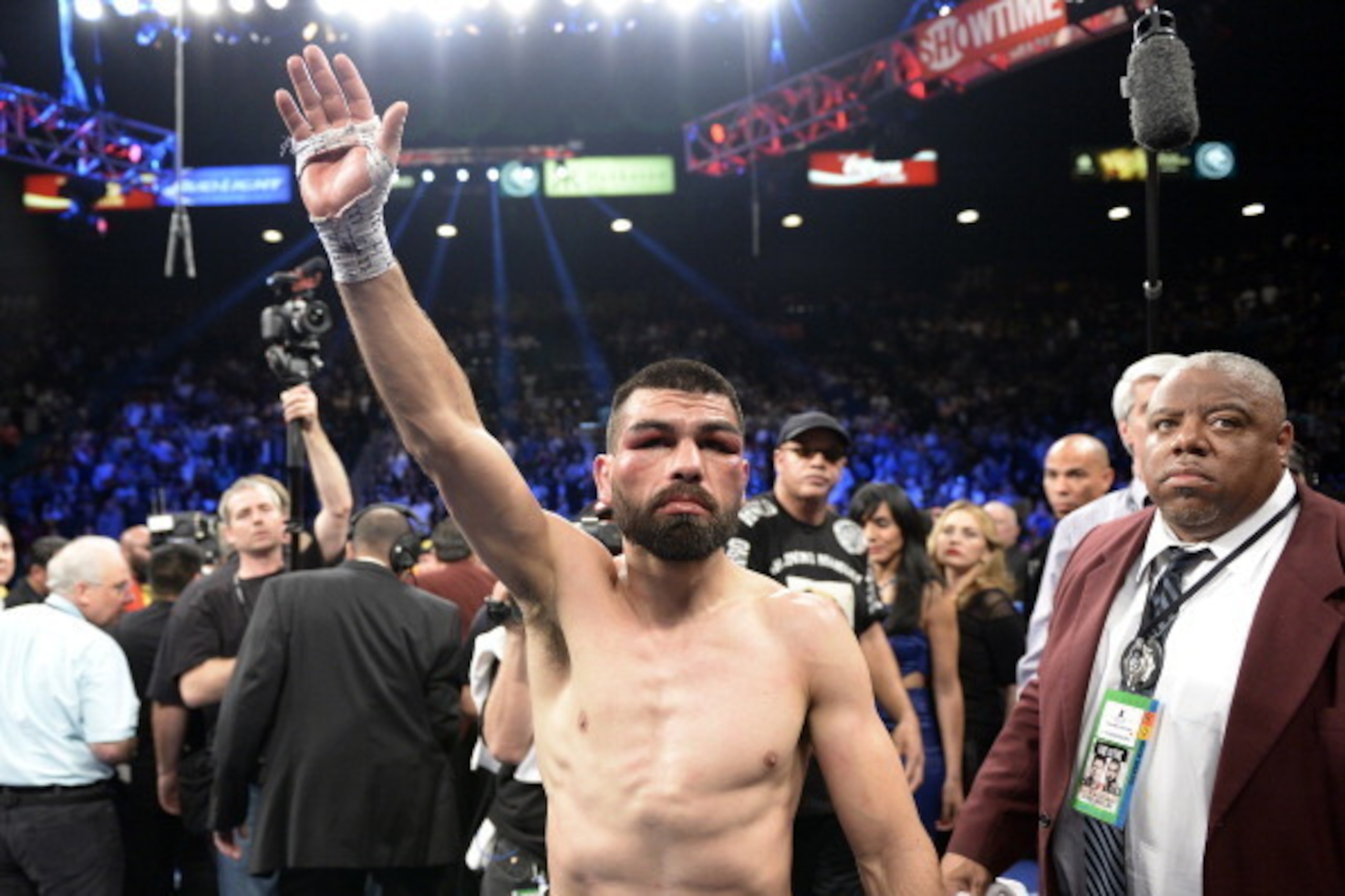 LAS VEGAS, NV - MARCH 8: Alfredo Angulo waves to fans as he leaves the ring after referee Tony Weeks stopped the fight in the 10th round during the non-title, 12-round super welterweight bout against Canelo Alvarez at the MGM Grand Garden March 8, 2014, i