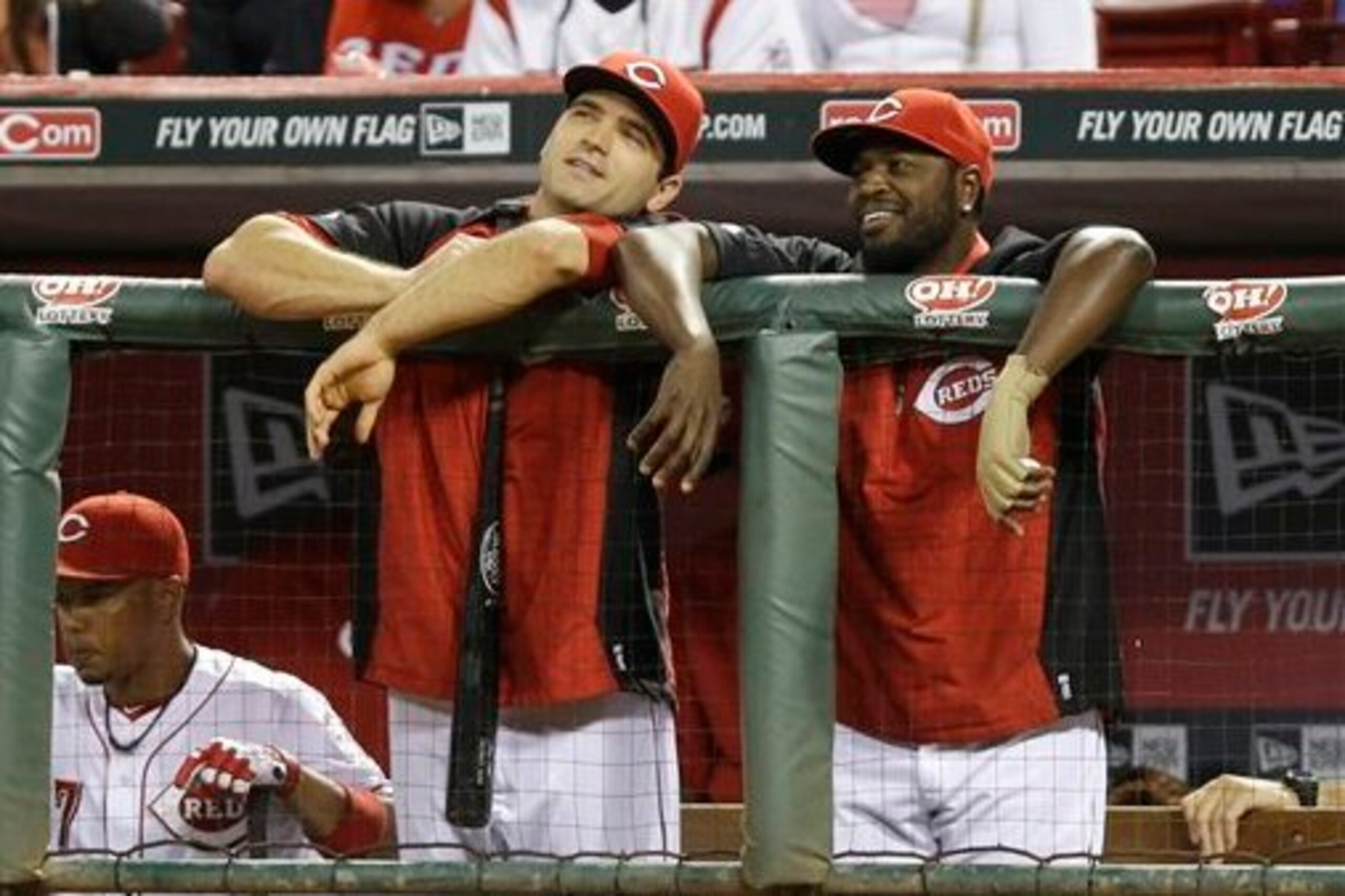 The Reds have had a lot of money stuck on the shelf this season, including Joey Votto (left) and Brandon Phillips.