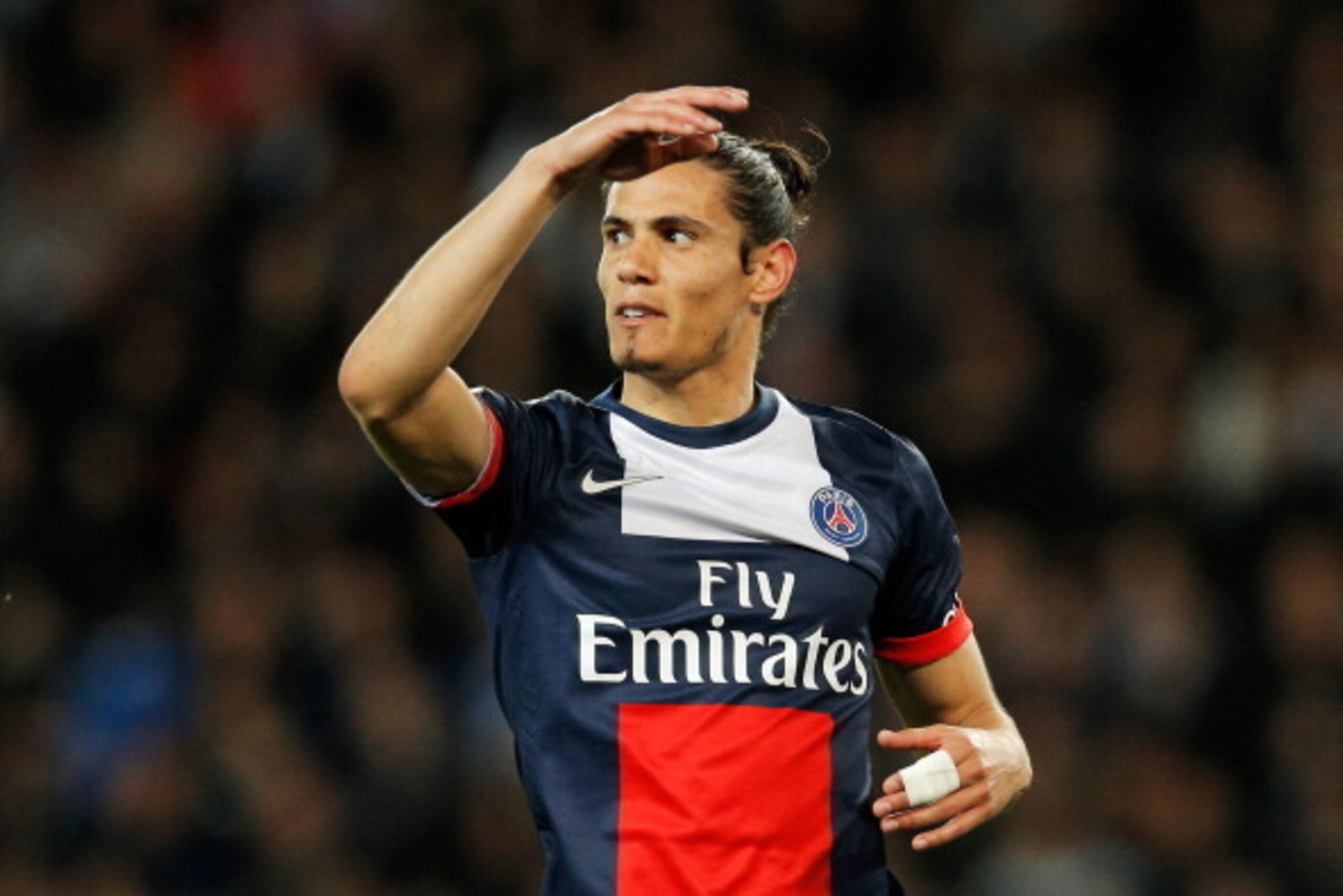 PARIS, FRANCE - MAY 07:  Edinson Cavani of PSG reacts to a missed chance on goal during the Ligue 1 match between Paris Saint-Germain FC and Stade Rennais FC at Parc des Princes on May 7, 2014 in Paris, France.  (Photo by Dean Mouhtaropoulos/Getty Images)