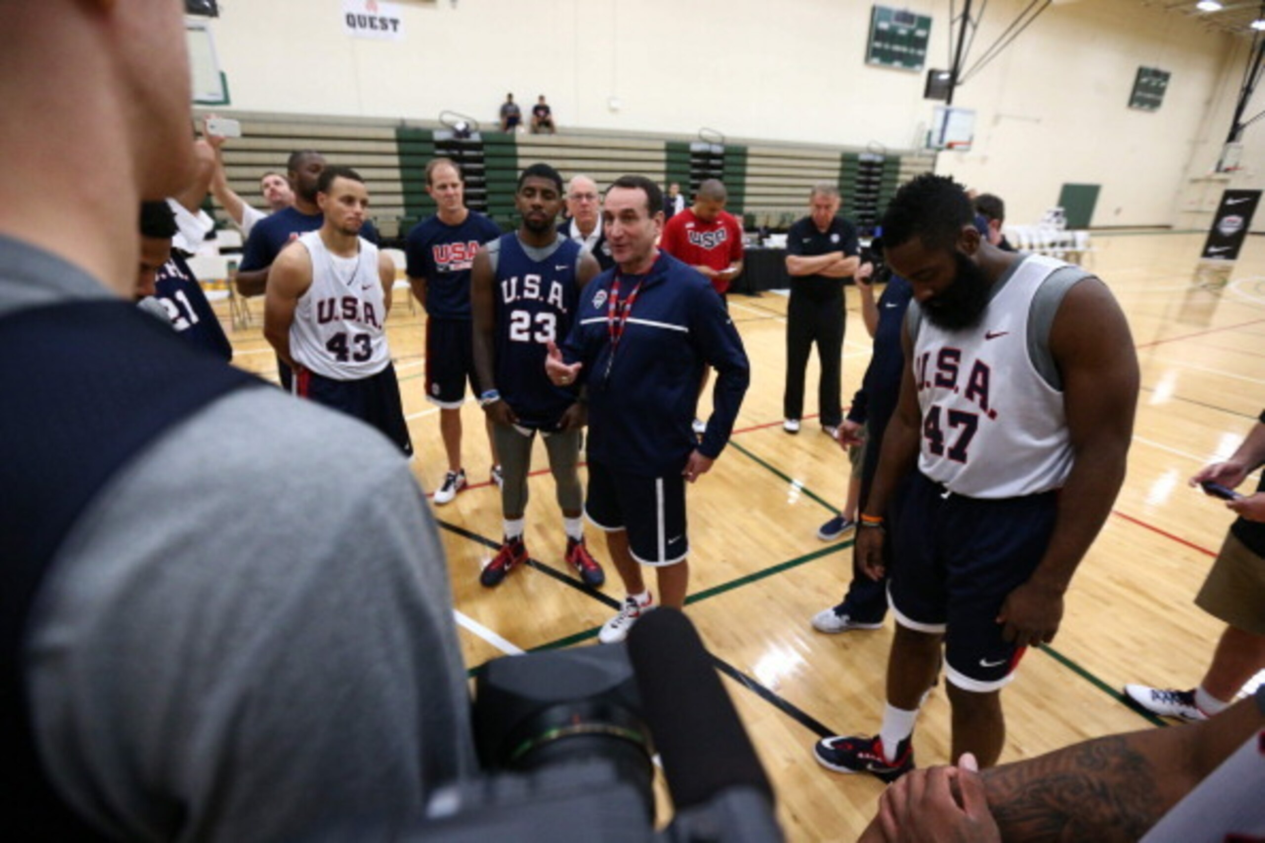 CHICAGO, IL - AUGUST 15: Head Coach Mike Krzyzewski of the USA Basketball Men's National Team huddles up during practice at the Quest MultiSport Facility on August 15, 2014 in Chicago, Illinois.  NOTE TO USER: User expressly acknowledges and agrees that, 