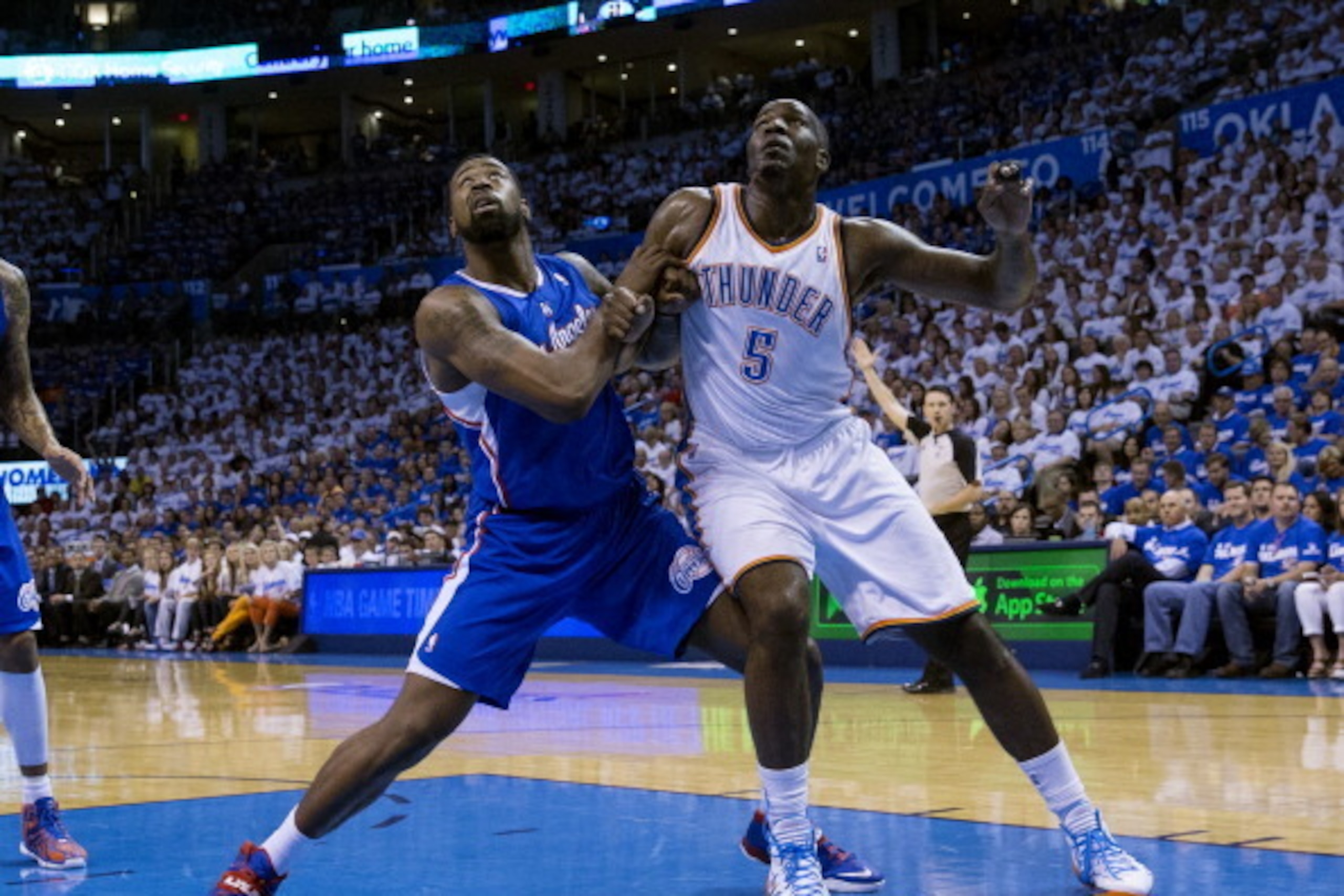 OKLAHOMA CITY, OK - May 7: DeAndre Jordan #6 of the Los Angeles Clippers battles for a rebound against Kendrick Perkins #5 of the Oklahoma City Thunder in Game 2 of the Western Conference Semifinals during the 2014 NBA Playoffs at the Chesapeake Arena on 