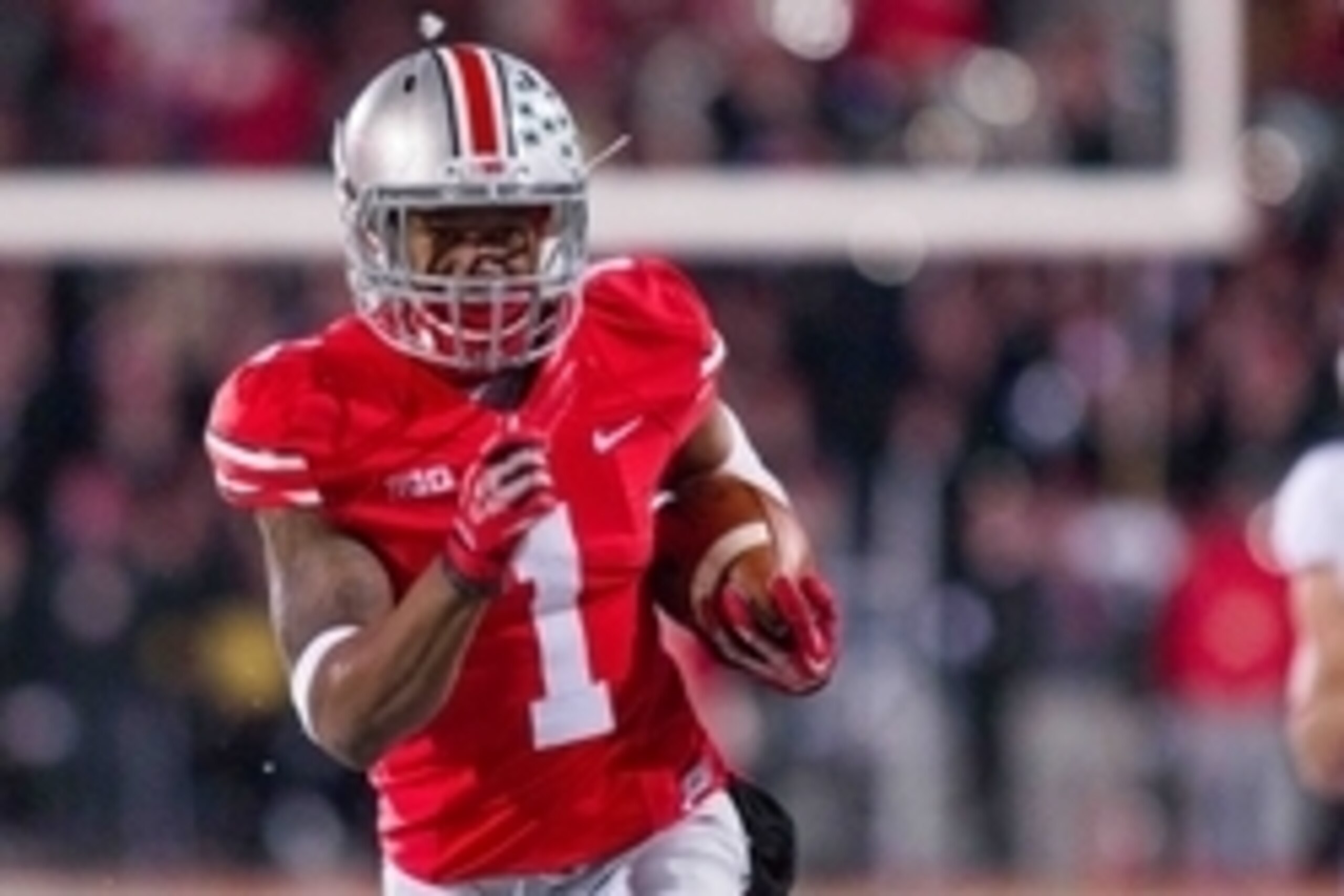 Nov 23, 2013; Columbus, OH, USA; Ohio State Buckeyes running back Dontre Wilson (1) runs with the ball and scores a touchdown in the third quarter of the game against the Indiana Hoosiers at Ohio Stadium. Ohio State Buckeyes beat Indiana Hoosiers 42-14. M Nov 23, 2013; Columbus, OH, USA; Ohio State Buckeyes running back Dontre Wilson (1) runs with the ball and scores a touchdown in the third quarter of the game against the Indiana Hoosiers at Ohio Stadium. Ohio State Buckeyes beat Indiana Hoosiers 42-14. M