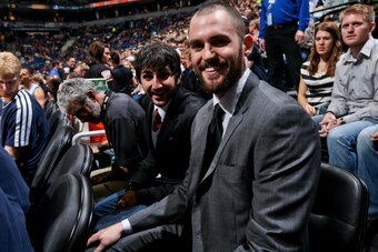 MINNEAPOLIS, MN - NOVEMBER 9: Ricky Rubio #9, left, and Kevin Love #42 of the Minnesota Timberwolves sit on the sidelines in street clothes as their team plays against the Indiana Pacers on November 9, 2012 at Target Center in Minneapolis, Minnesota. NOTE
